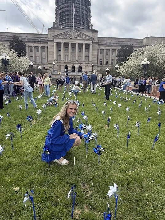 Planting a pinwheel to kick off April as Child Abuse Prevention Month