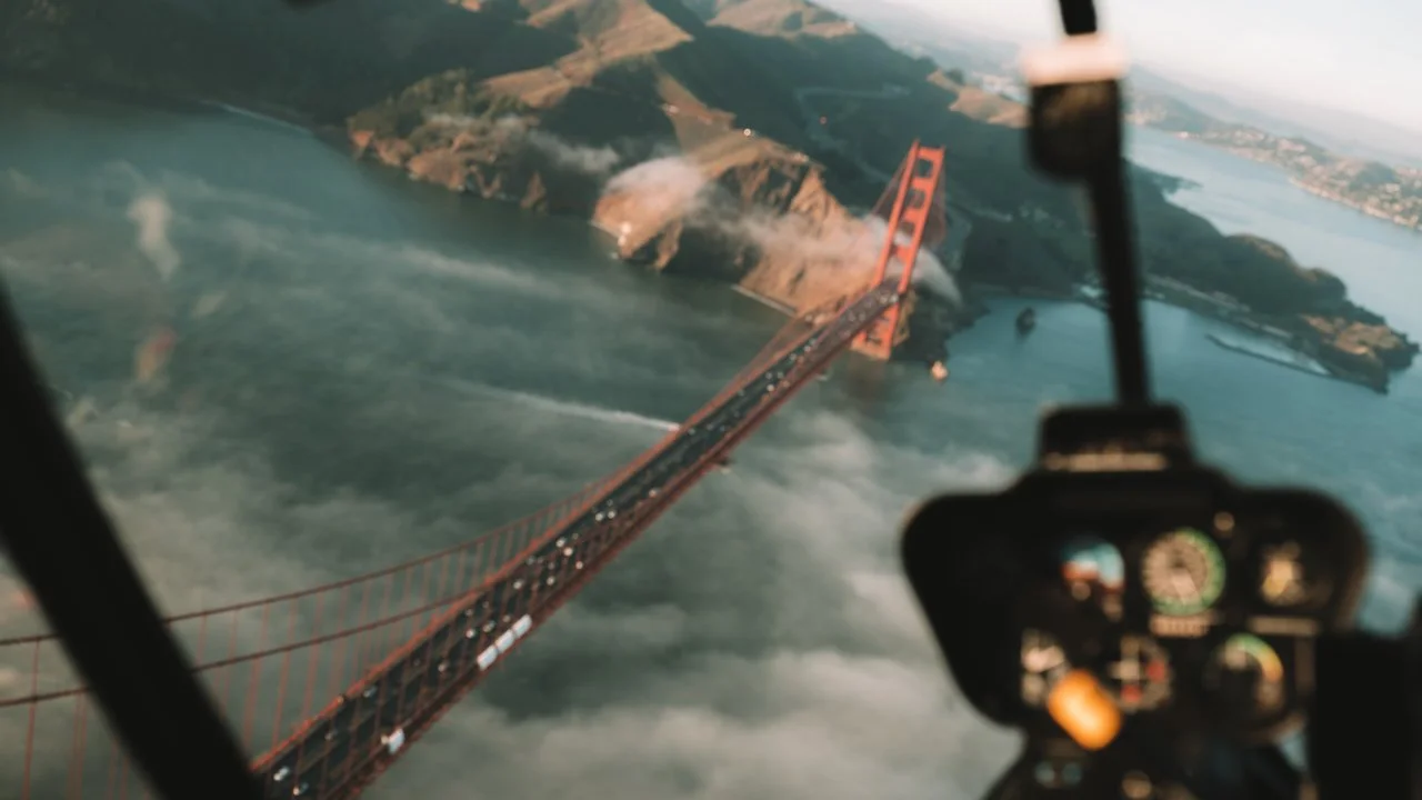 Noah Lucas in a helicopter over the Golden Gate Bridge.