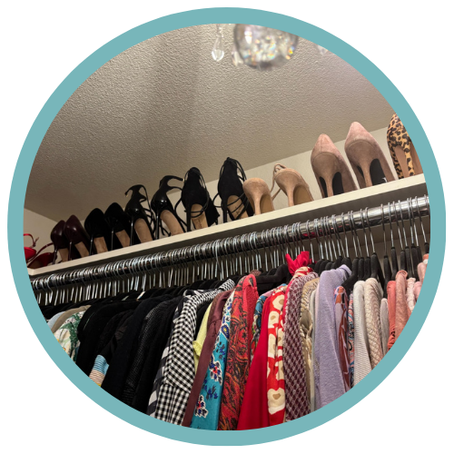 Clothing rack with various shirts and jackets, and a shelf above with different pairs of high-heeled shoes.