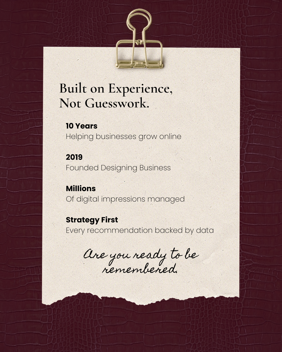 A printed flyer on a cream-colored paper with black text, attached to a dark red textured background with a gold binder clip. The flyer highlights a business's experience, achievements, and strategy, with a handwritten message at the bottom reading, 'Are you ready to be remembered.'