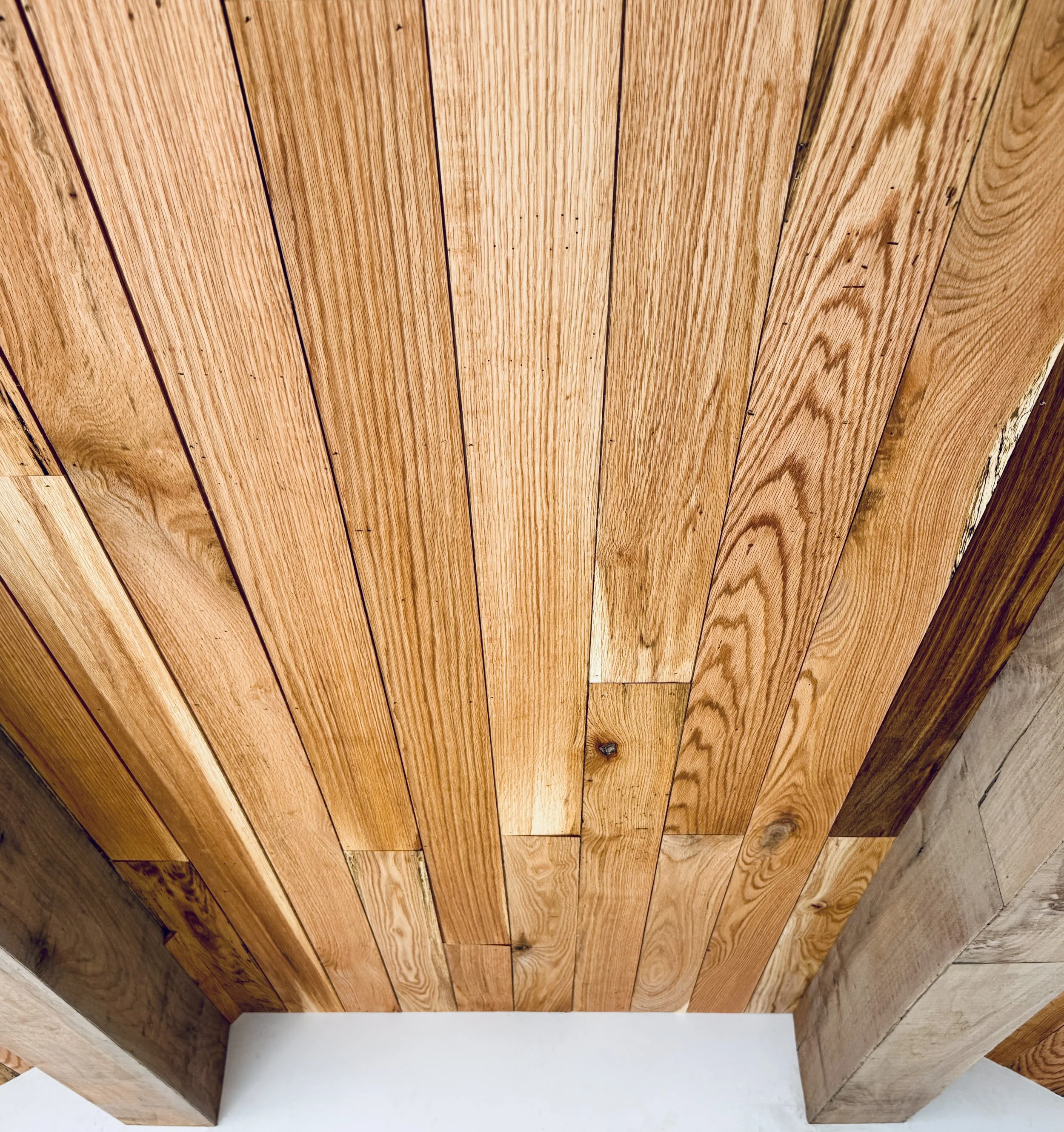 red oak and unstained walnut clad beams