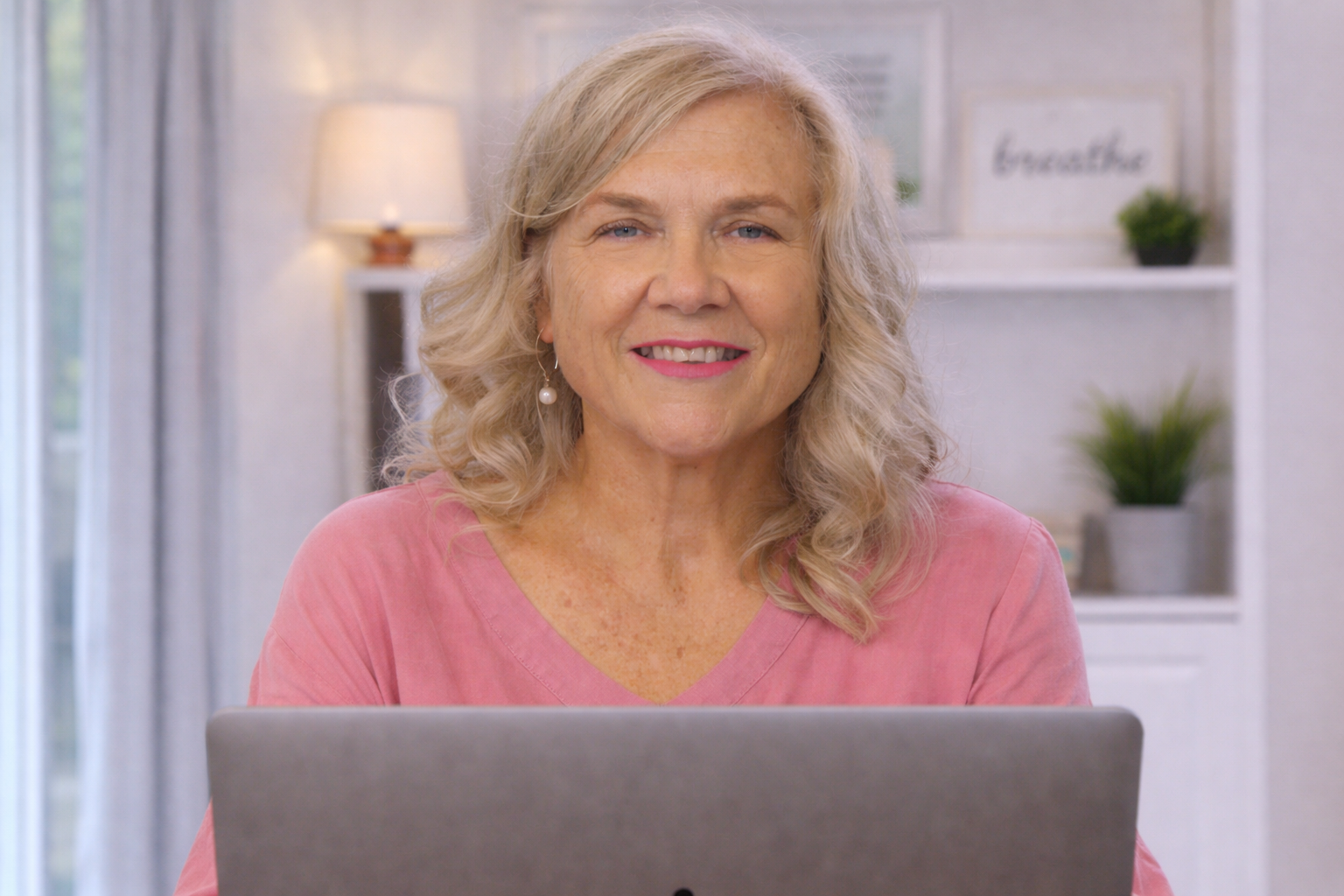 Joanna Wood, counsellor for midlife women, smiling warmly during an outdoor portrait session.