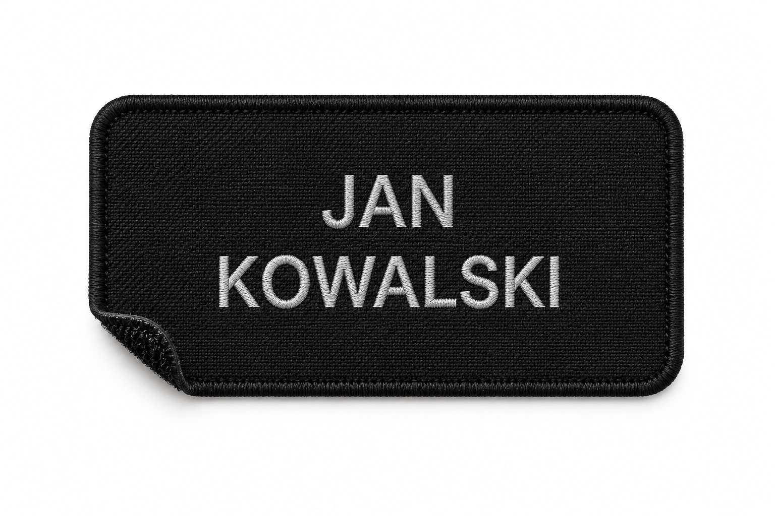 Imiennik OSP z czarną ramką oraz srebrnym imieniem i nazwiskiem na czarnym tle.
