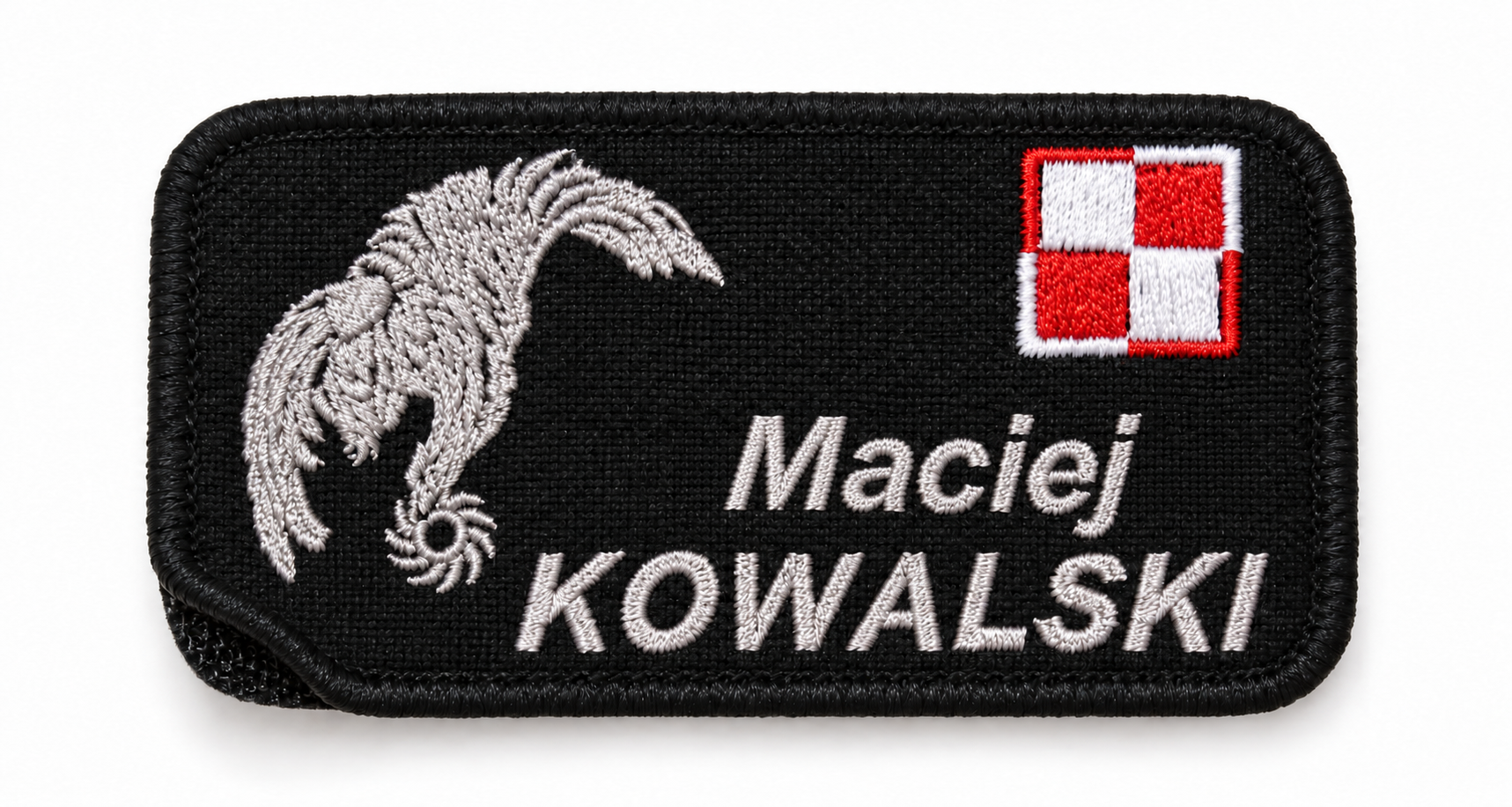 Black embroidered patch with a white horse head, a Polish flag in the top right corner, and the name "Maciej Kowalski" embroidered in white.