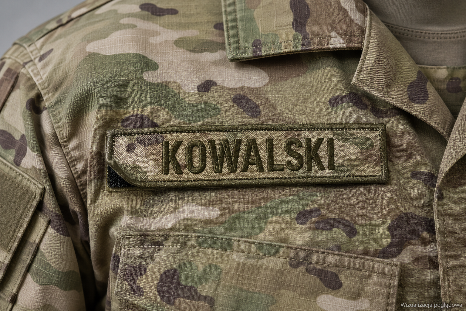 Close-up of a military camouflage uniform with a name patch reading 'KOWALSKI'.