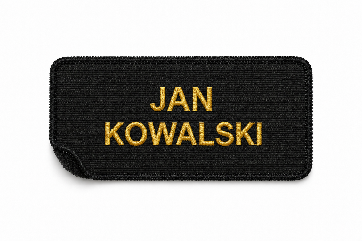 Imiennik PSP ze złotym imieniem i nazwiskiem w dwóch wierszach, na czarnym tle z czarną ramką.