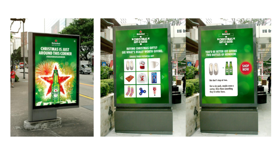 A digital billboard displaying a Heineken advertisement with a green background, the message "Christmas is just around this corner," and a large Heineken bottle with fireworks in the background.