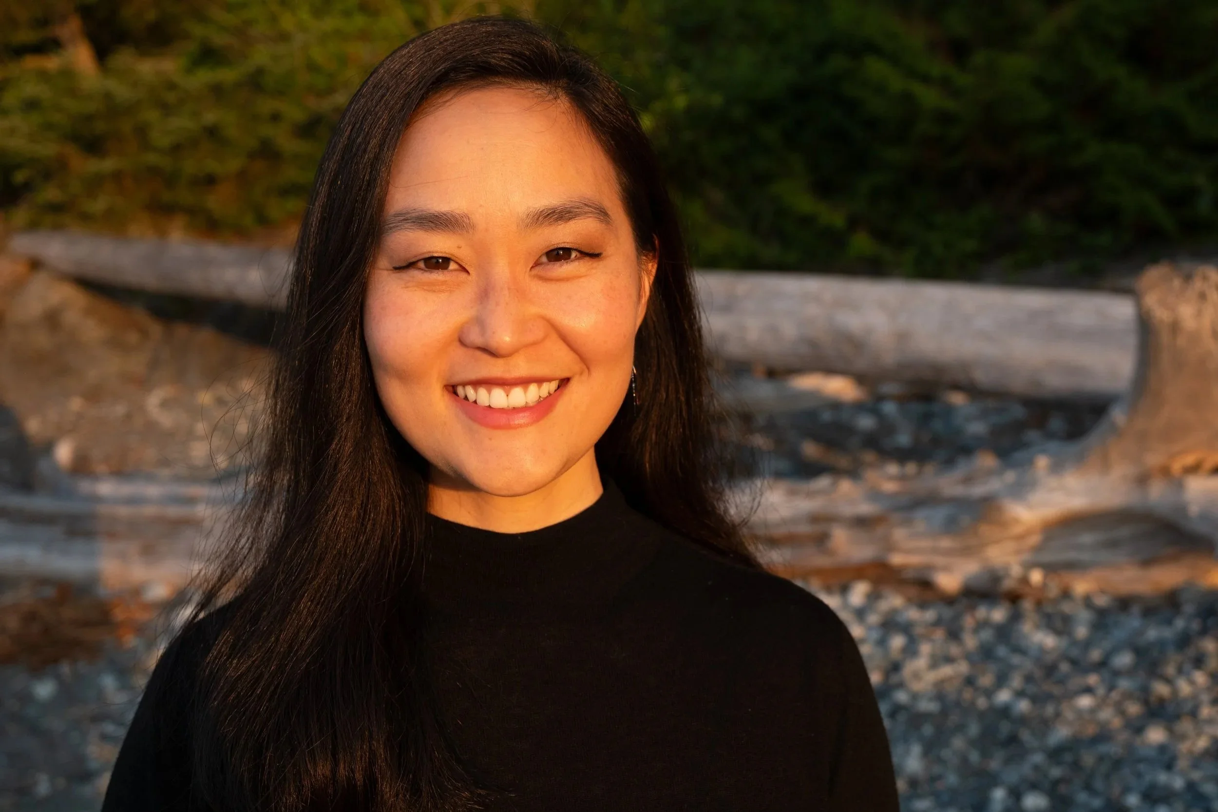 Psychiatric provider standing outdoors in a calm, natural setting