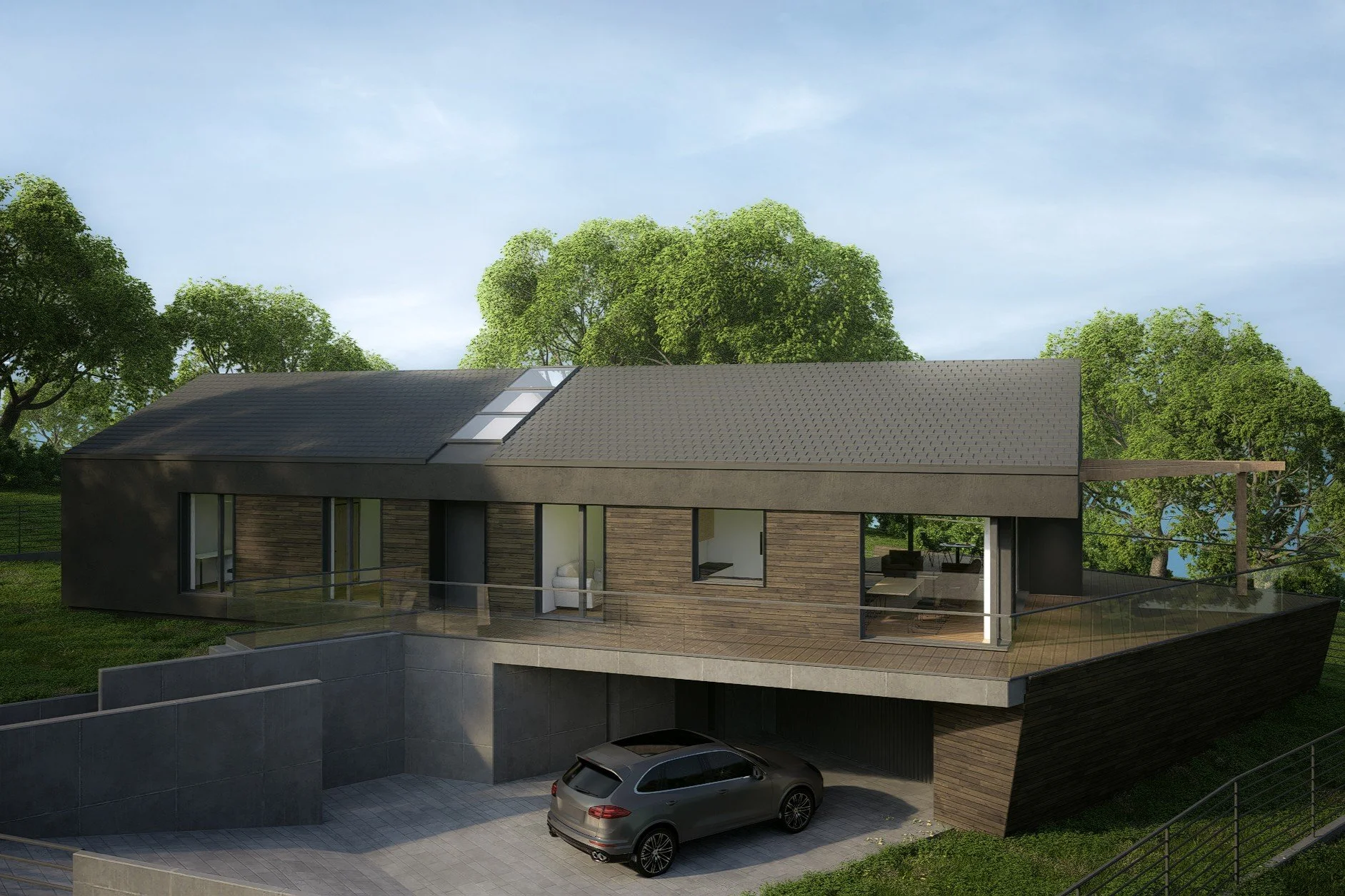 A modern house with a sloped roof, large windows, a balcony, and a garage with a car parked underneath, surrounded by greenery and trees.