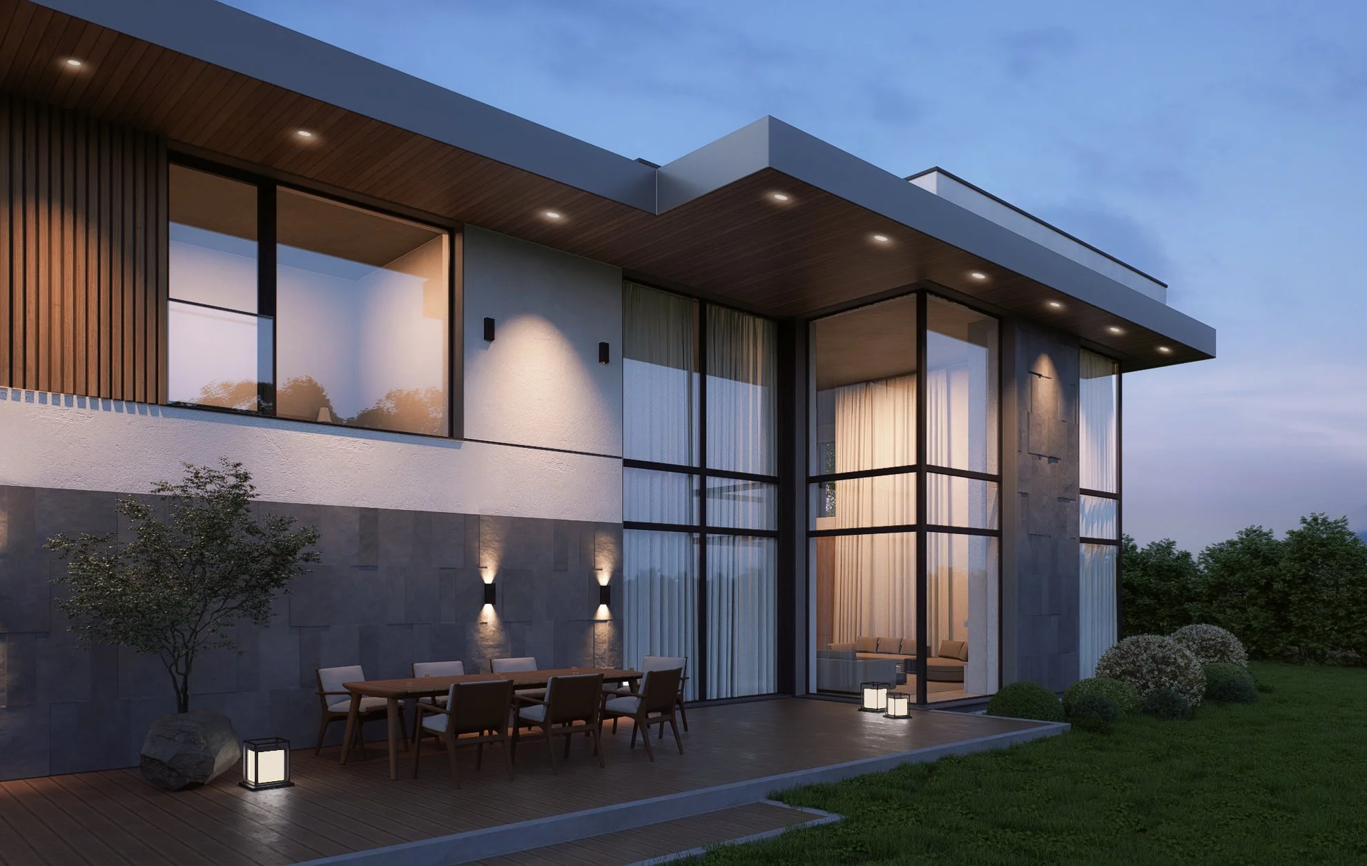 Modern two-story house with large glass windows, outdoor dining area, and landscaped yard during evening.