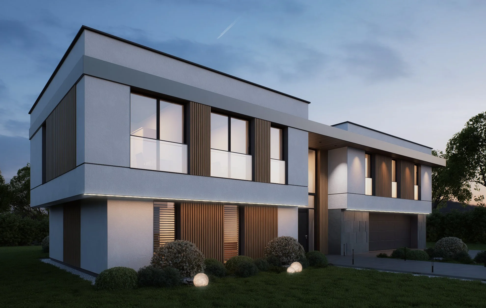 A modern two-story house with white walls, large windows, and vertical wooden accents. The house is illuminated with exterior lighting, and the yard has bushes and glowing ground lights. The sky is partly cloudy at dusk.