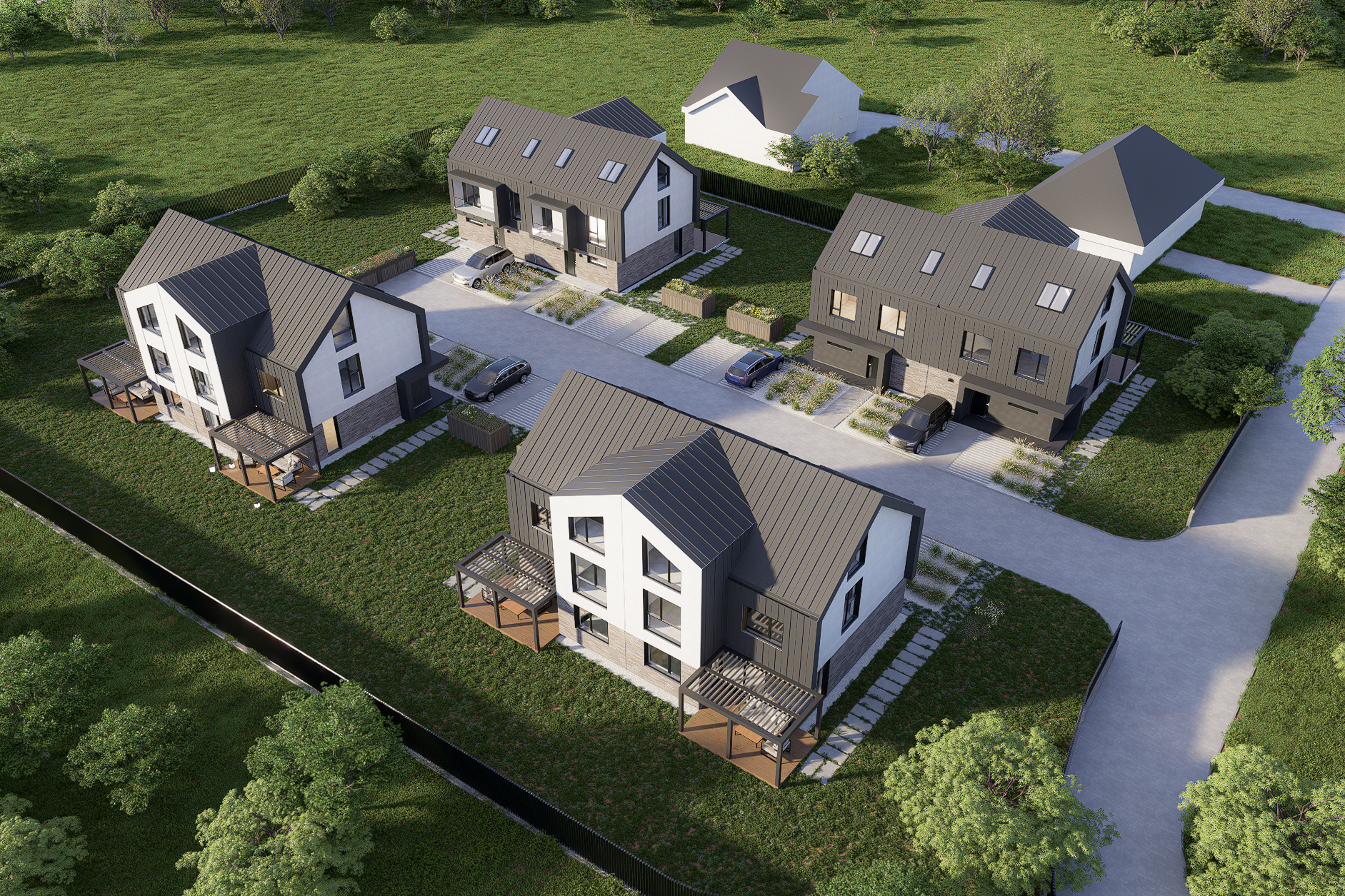 An aerial view of a modern residential housing complex with several white and black multi-story houses, driveways with parked cars, green lawns, and surrounding trees.