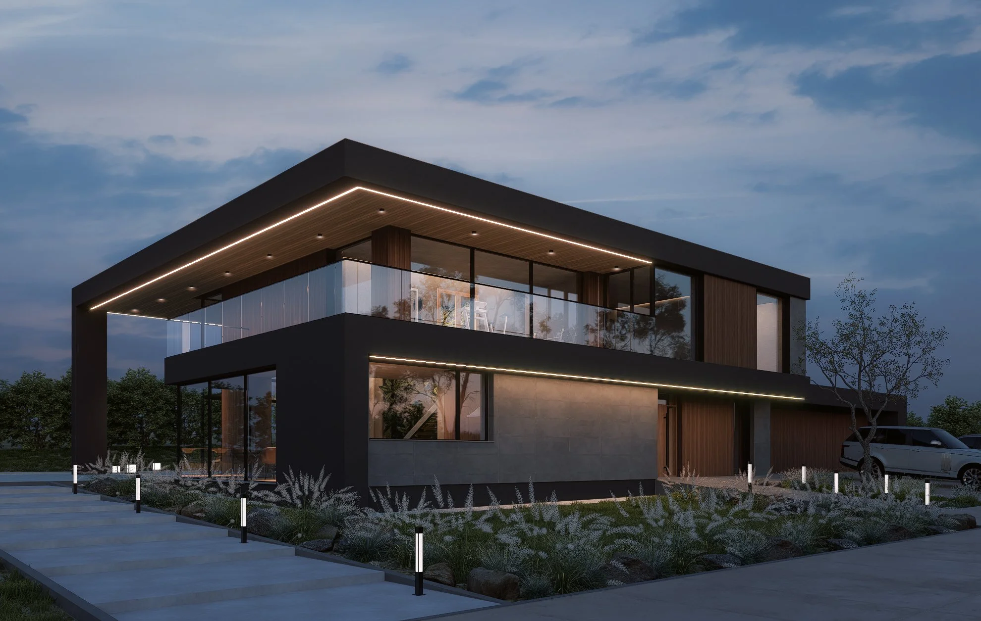Modern two-story house with black and wood exterior, large glass windows, with landscaping and parking lot, during evening.