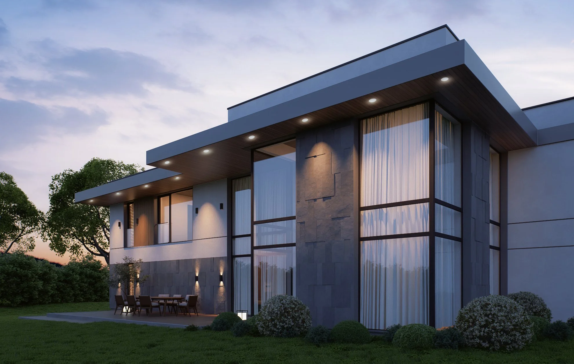 Modern two-story house with large windows and outdoor patio, trees in the background, and subtle exterior lighting at dusk.