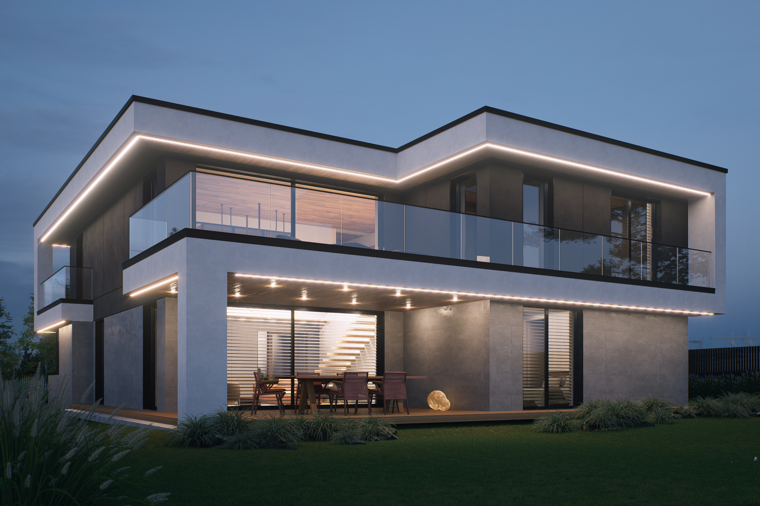 Modern two-story house at dusk with exterior lighting, glass balcony, and patio seating area