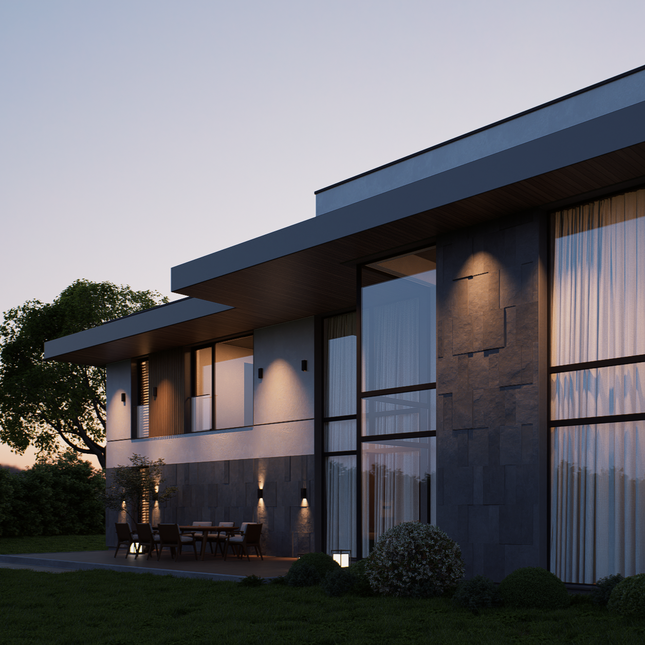 Modern two-story house with large glass windows, outdoor dining area, and landscaped yard during dusk.