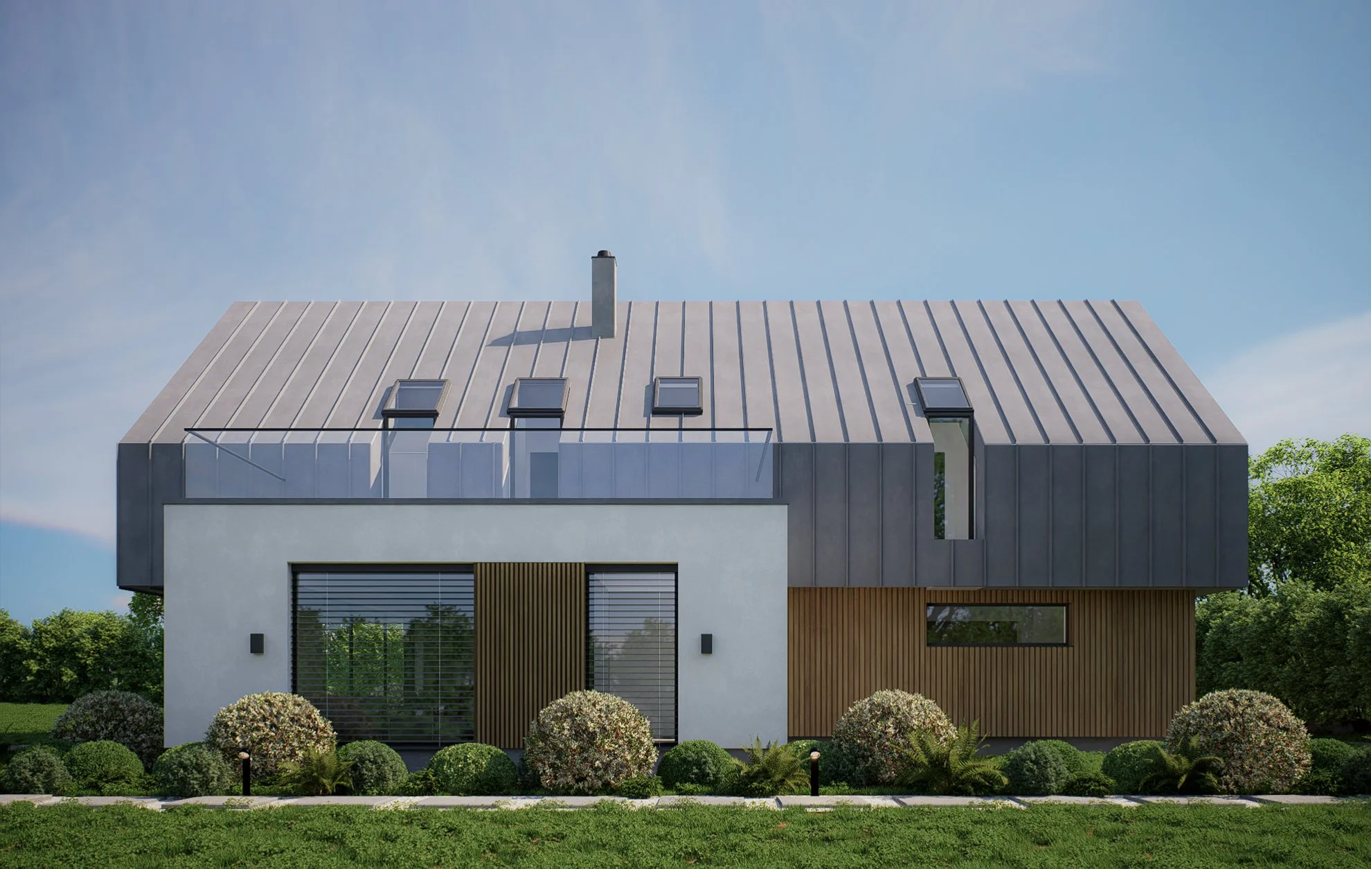 Modern house with a sloped metal roof, solar skylights, and a balcony, surrounded by landscaped bushes and trees.