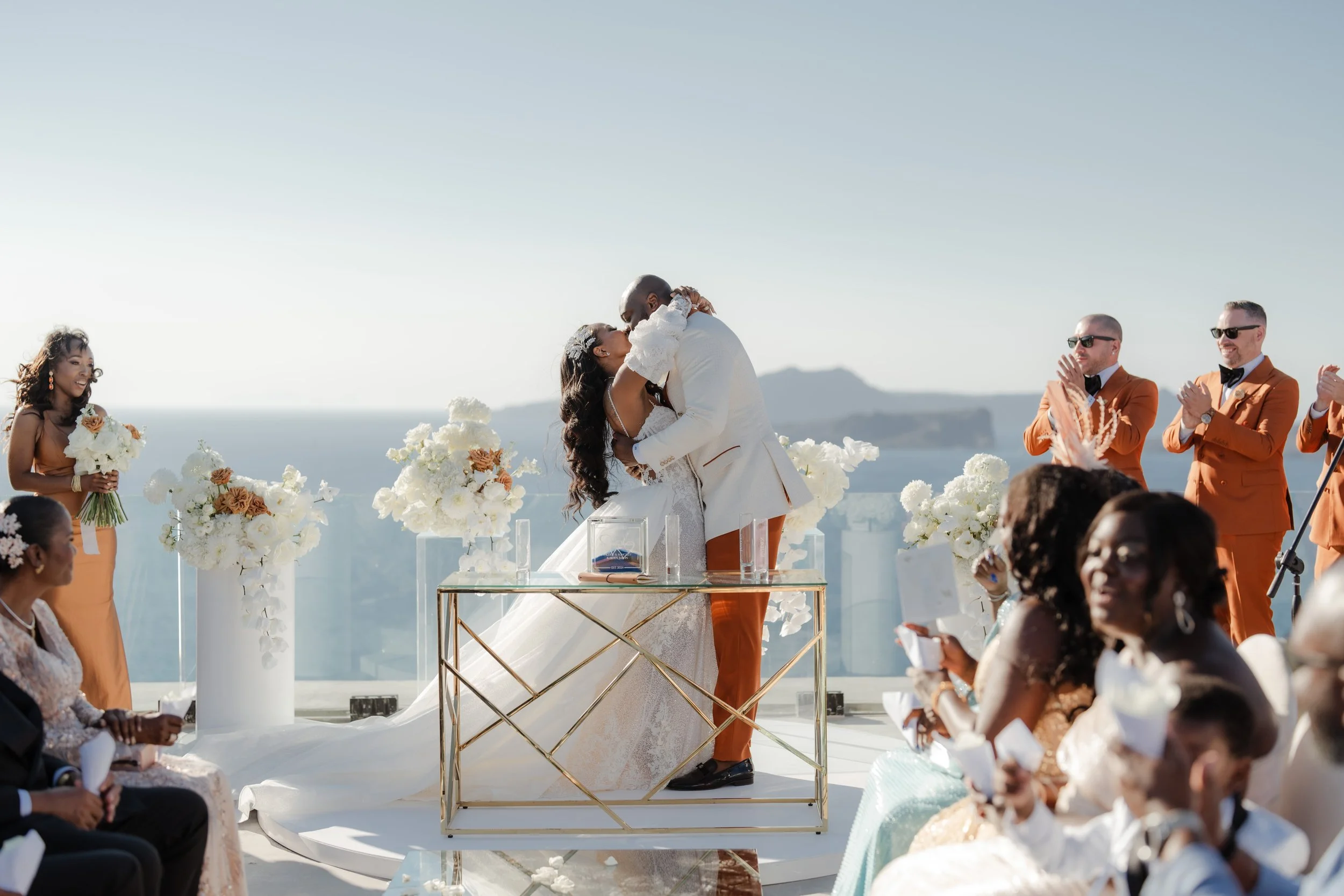 Luxury Wedding Ceremony Kiss in Santorini, Greece
The couple share their first kiss overlooking the Santorini caldera. A timeless and romantic highlight of a luxury wedding in Greece.