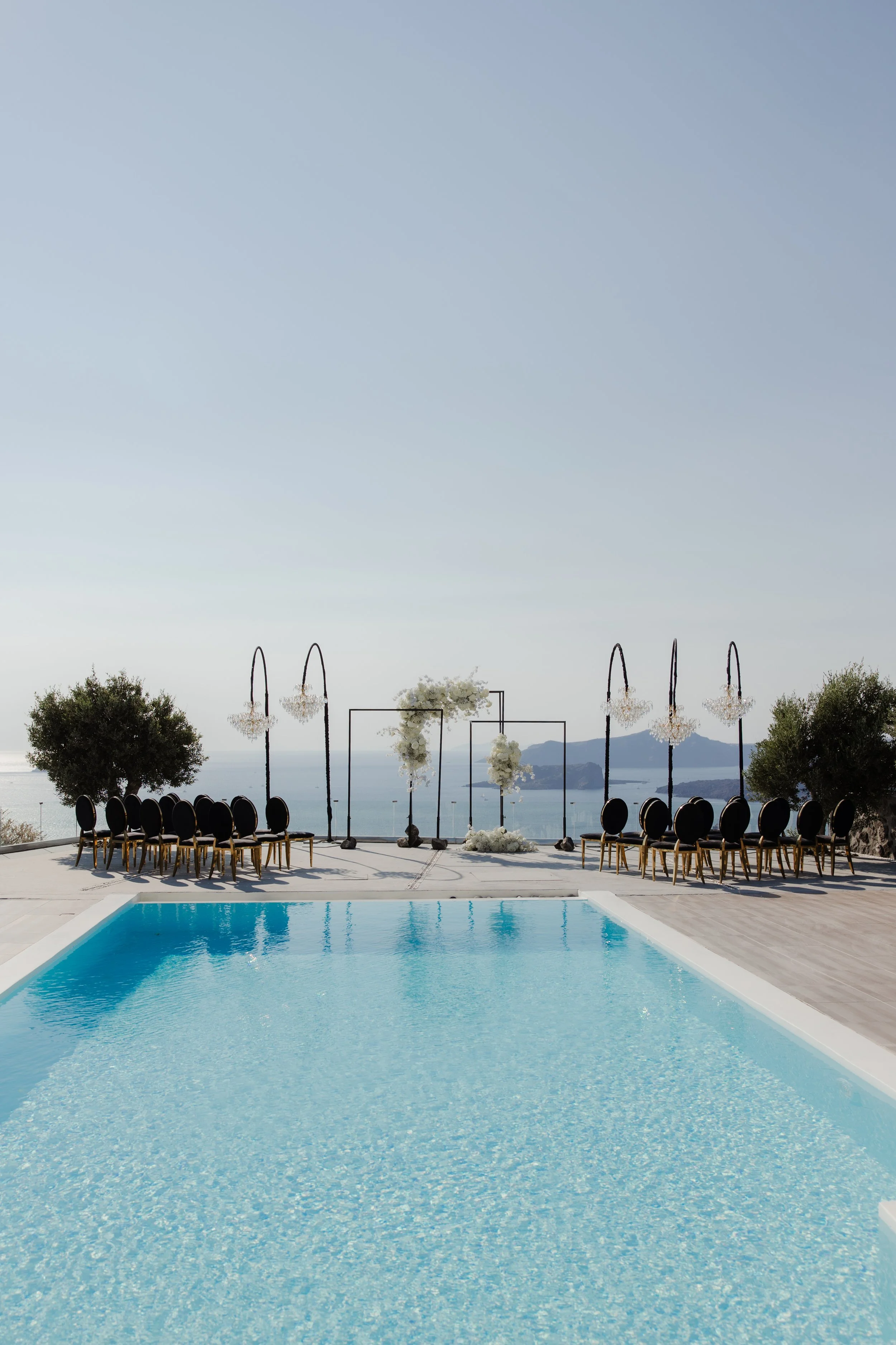 Luxury Wedding Venue in Greece
A stunning poolside view in Santorini, setting the stage for an unforgettable luxury wedding. Modern elegance meets the iconic beauty of Greece.