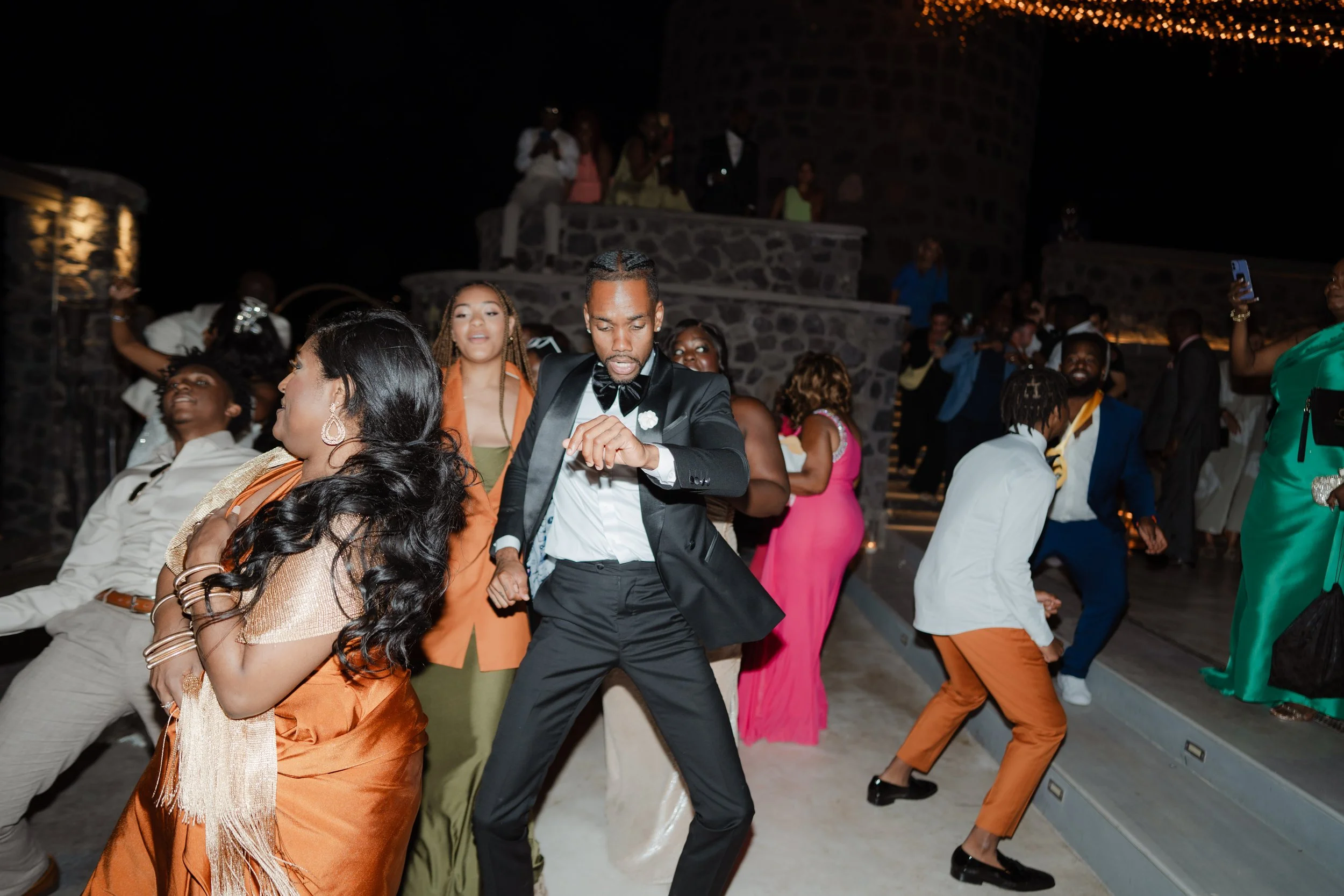 Luxury Wedding Dancing in Greece
Guests and the newlyweds enjoy the wedding party under the stars in Santorini. A joyful and unforgettable experience of a luxury wedding in Greece.