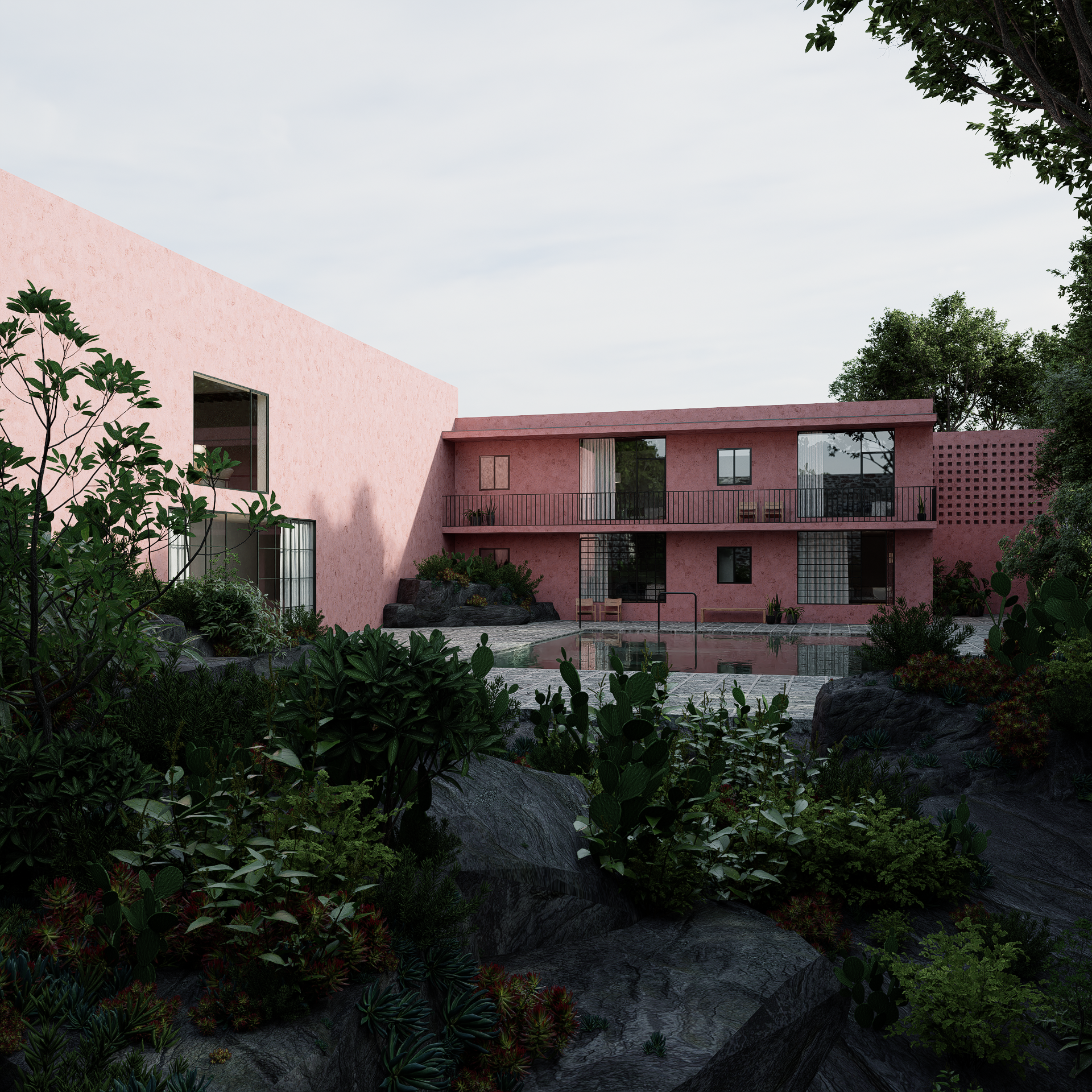Moderne roze gebouw met grote ramen, omgeven door groene planten en rotsen, met een zwembad vooraan en een overdekt balkon.