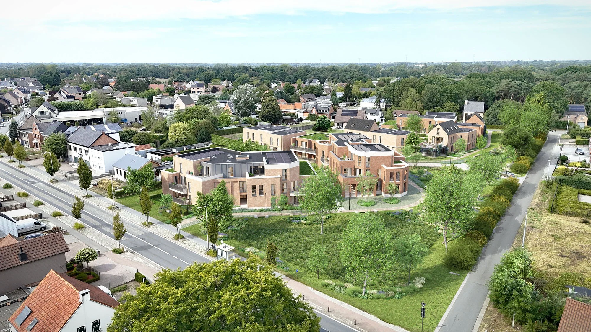 Luchtfoto van een woonwijk met moderne gebouwen en veel groene bomen, straten en tuinen.