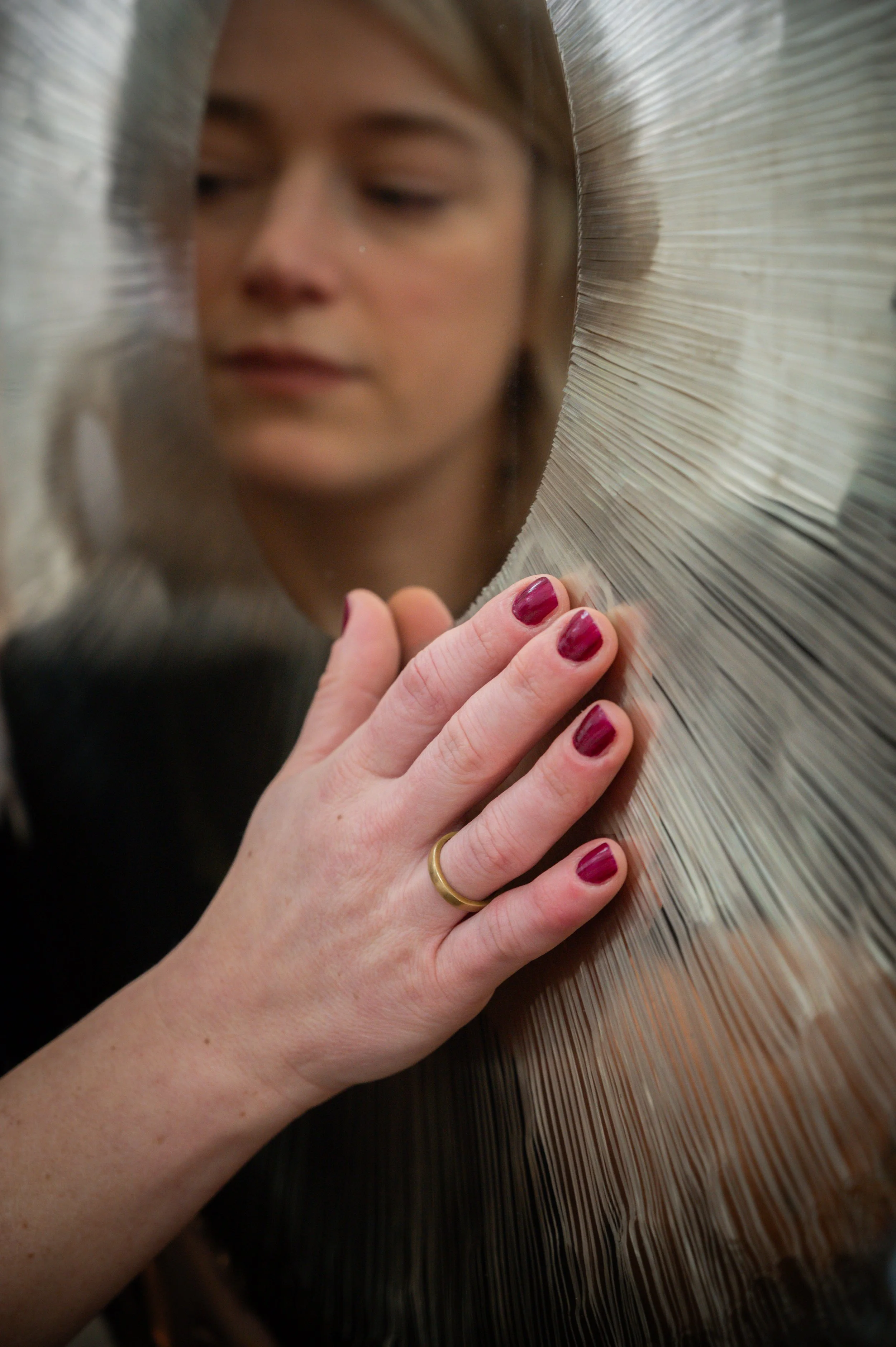 blond girl playing a symphonic gong