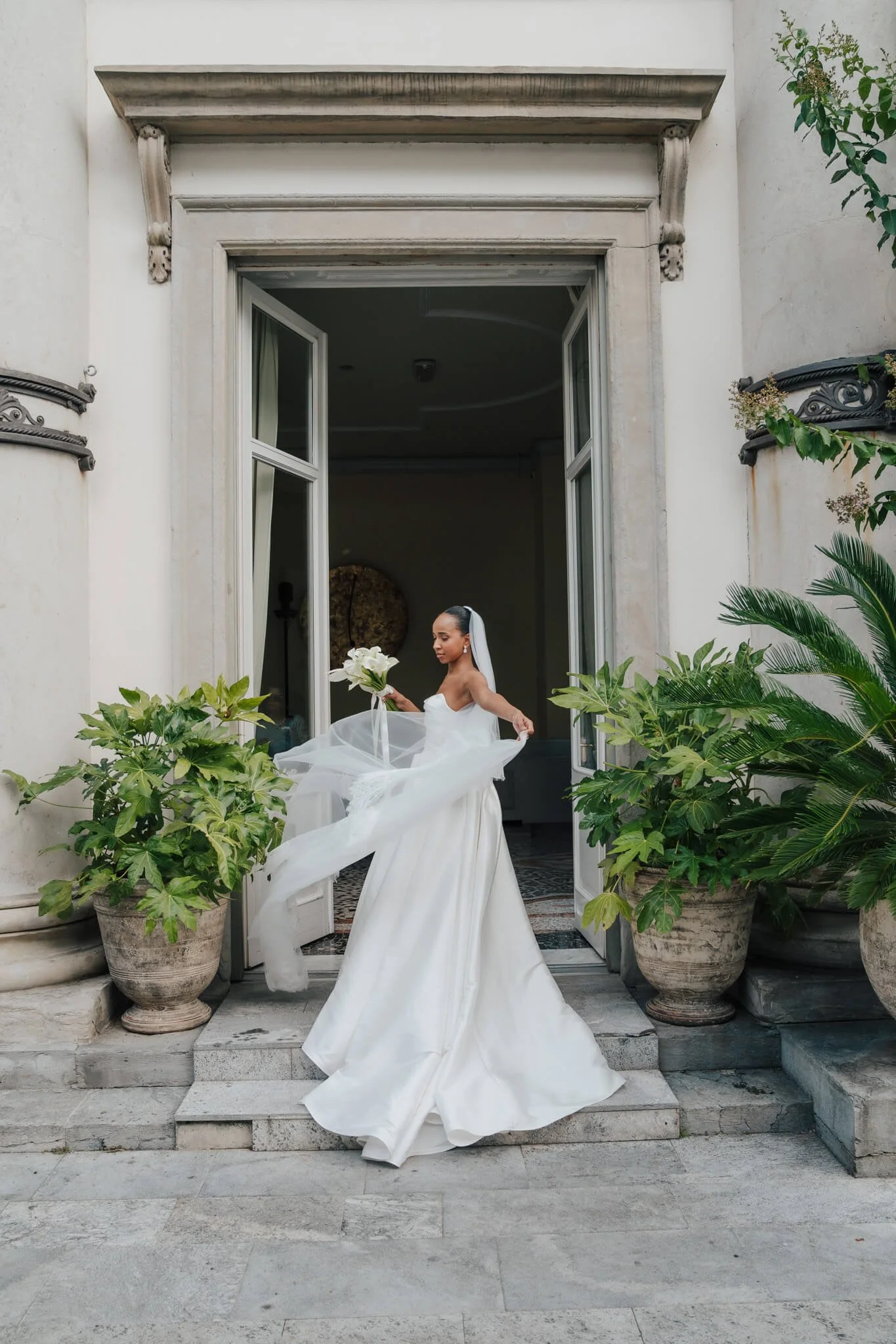 Bride in flowing dress captured at Lake Como wedding venue Villa Geno
