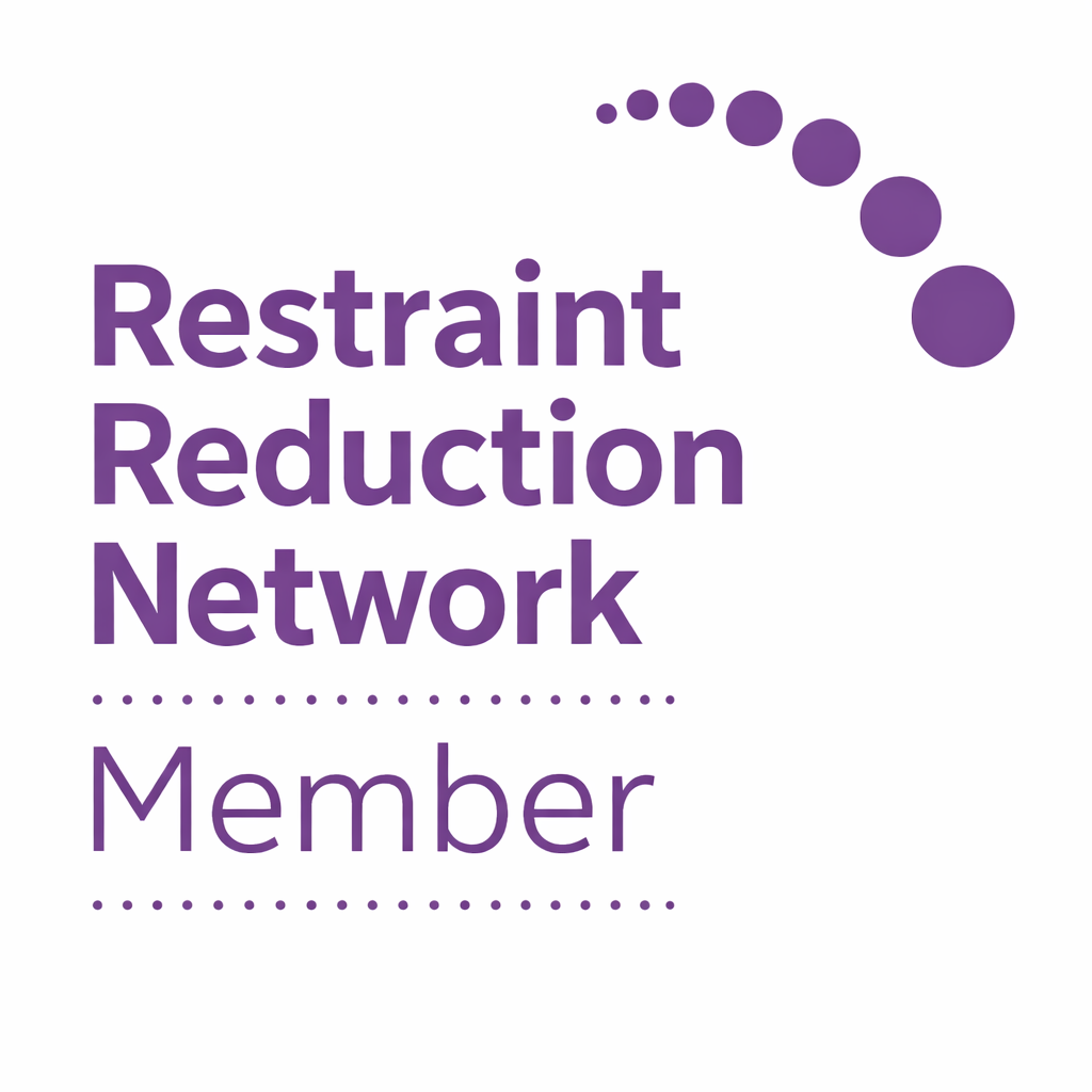 Logo of the Restraint Reduction Network with purple text and a curved dotted line above it, on a white background.