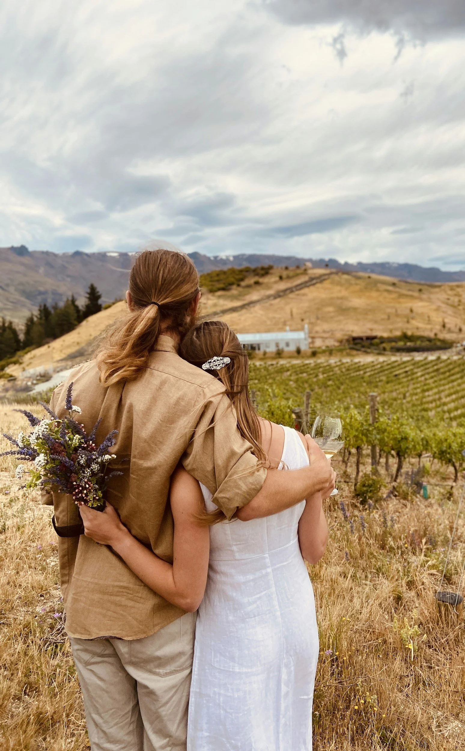 Couple embracing overlooking the Gold Coast Hinterland countryside at their elopement