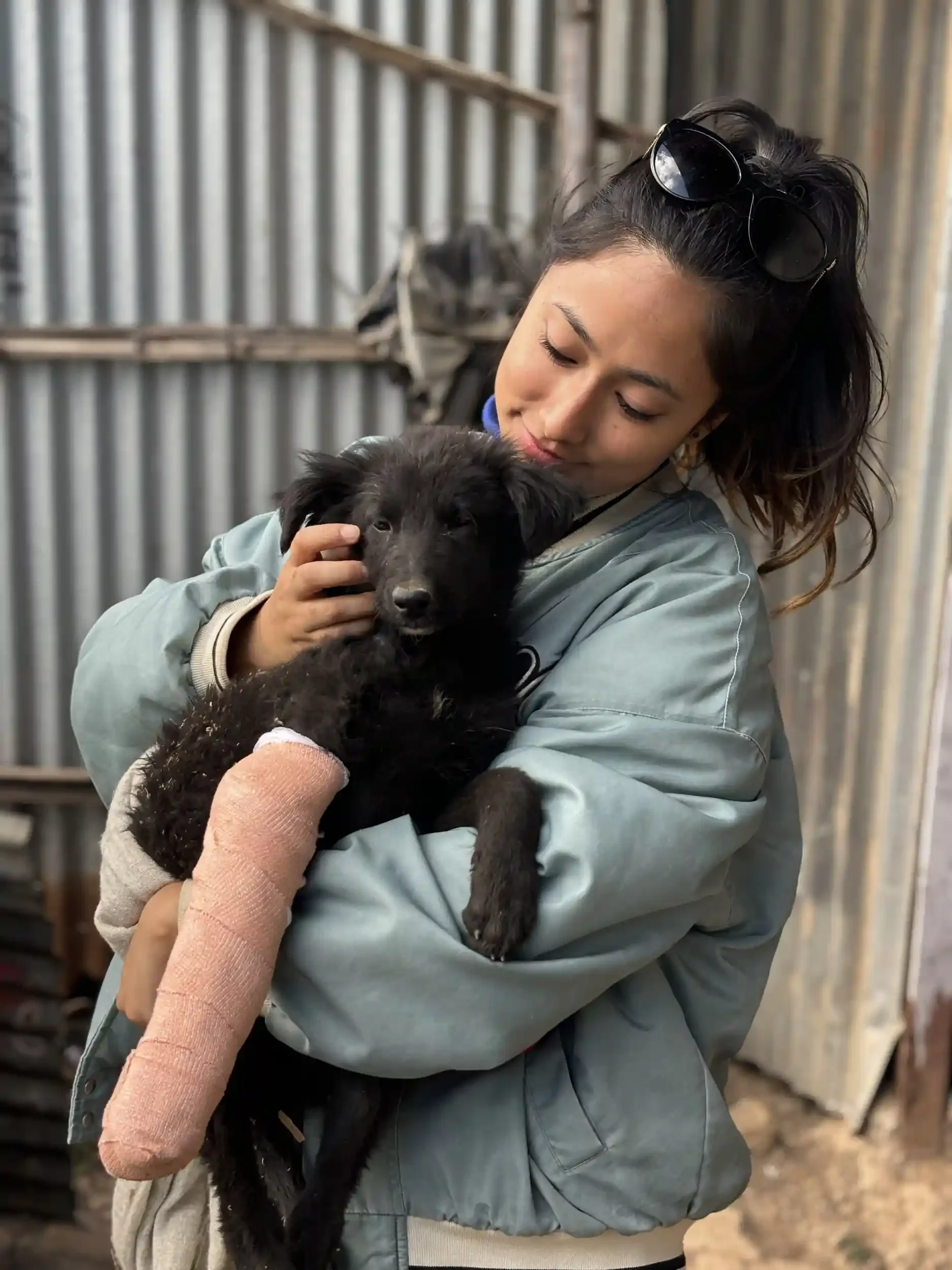 Our founder Bipsha with a street dog