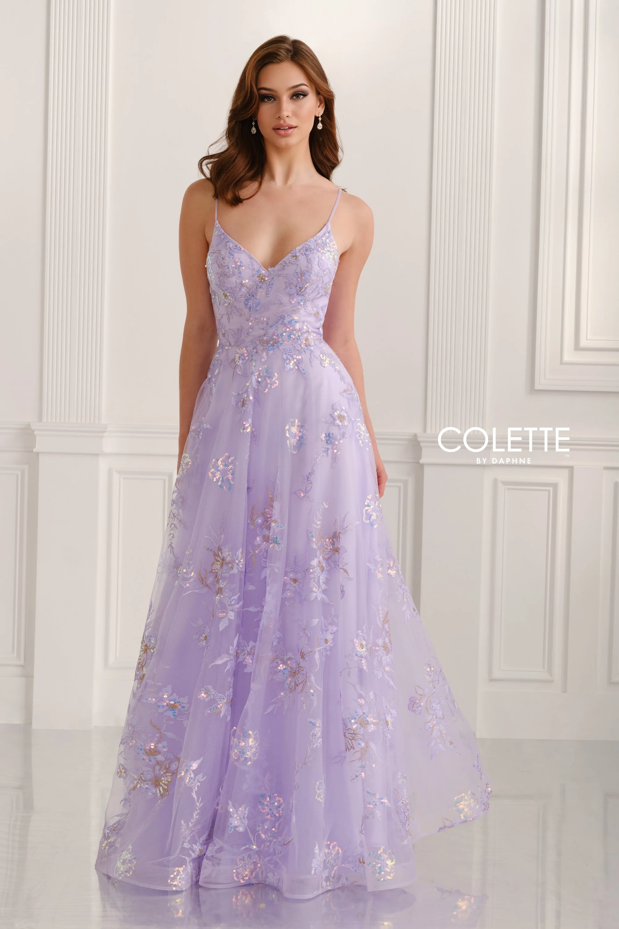 Colette - Lilac UK10 | Own the night with this sleeveless A-line gown in soft lilac, crafted from embroidered tulle and sparkling sequins. The V-neckline and boned bodice shape your look, while convenient pockets add a cool, unexpected touch. Perfect