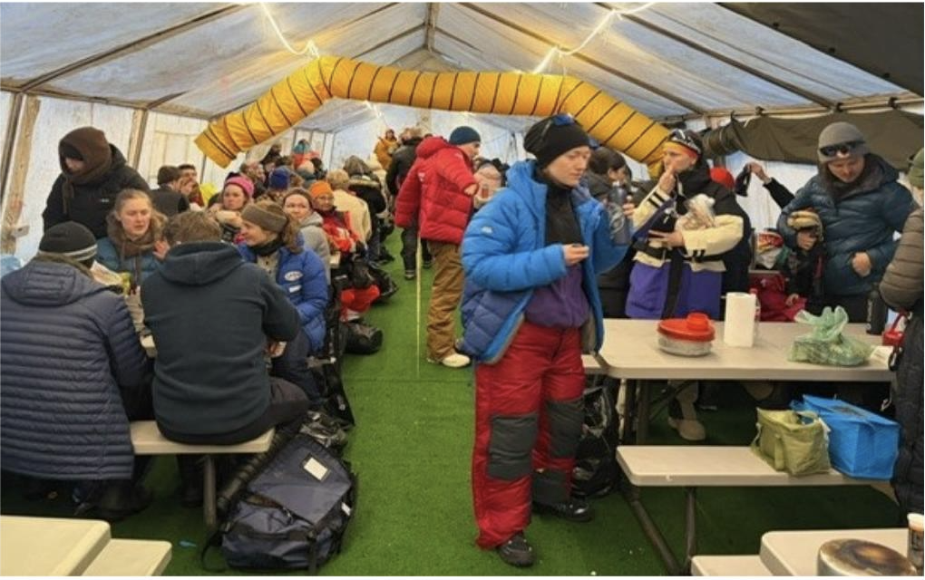 Food tent with skiers after day one Arctic Circle Race