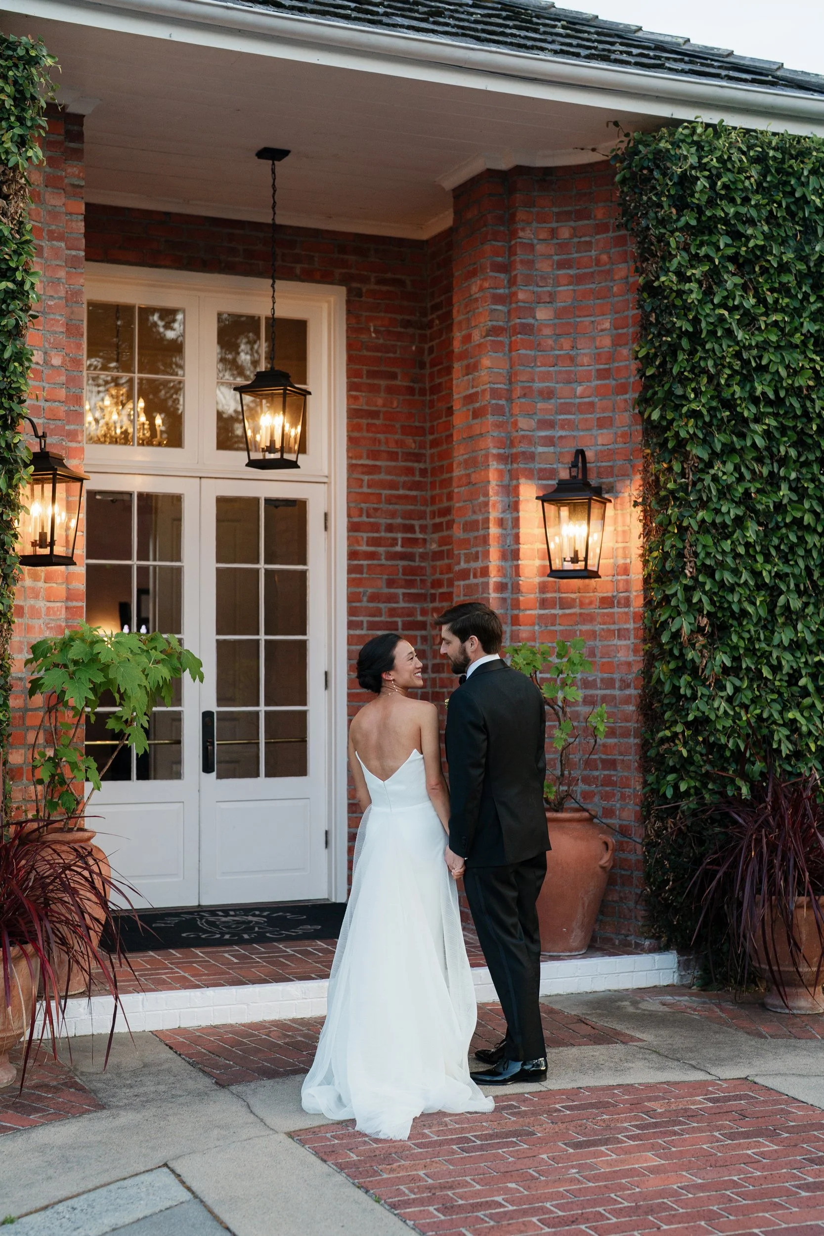The couple is posing for the wedding photographer in Santa Cruz.