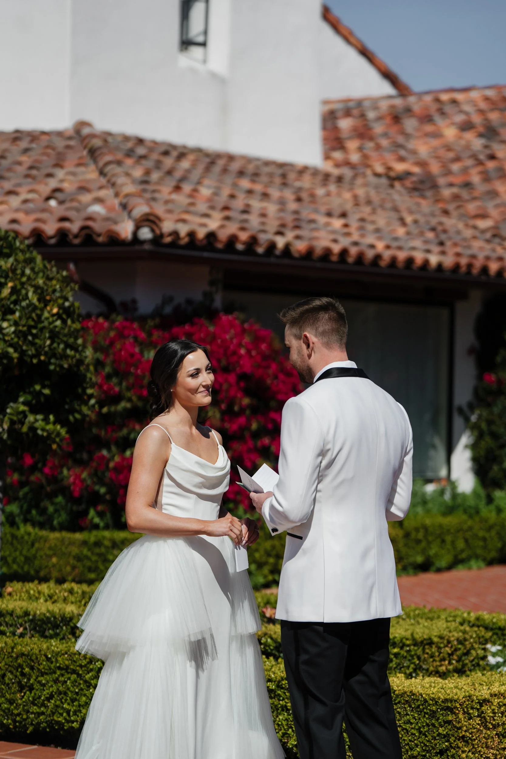 wedding photographer Pebble Beach- first look for a couple at Monterey Peninsula Country Club- the couple is exchanging vows
