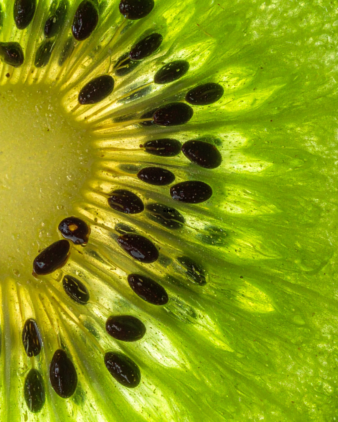A close up of a slice of kiwi