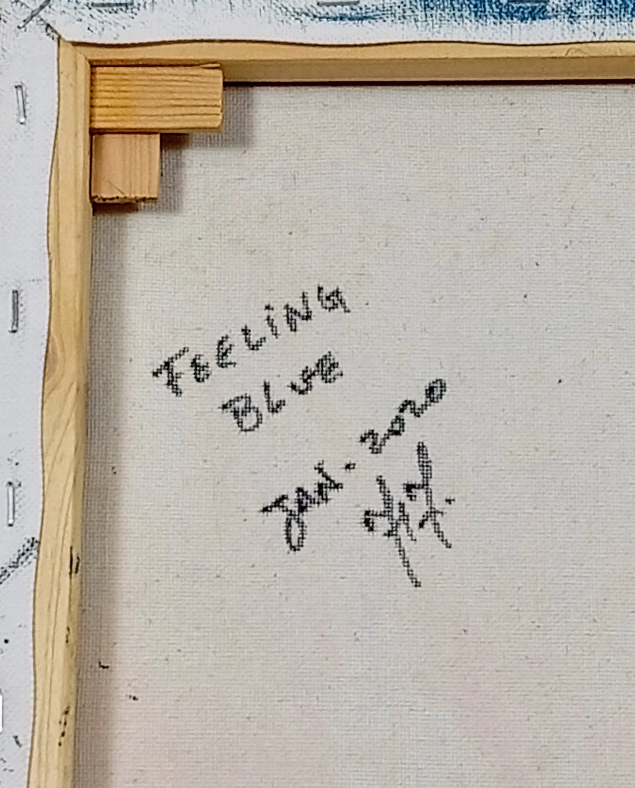 Back of the canvas of the painting Feeling Blue, with handwritten title, date “Jan. 2020” and artist’s signature.