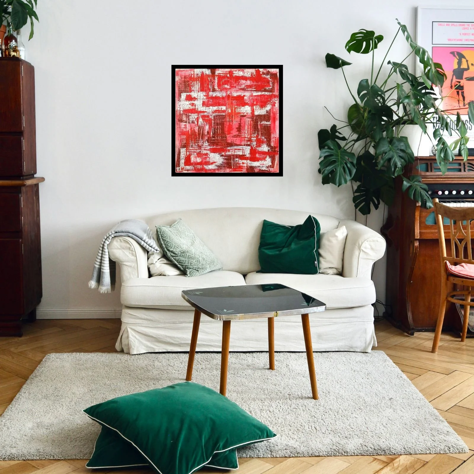 “Red Levels” acrylic on canvas painting, framed and displayed in a modern living room with white sofa and green cushions, June 2020, HMad Artworks.