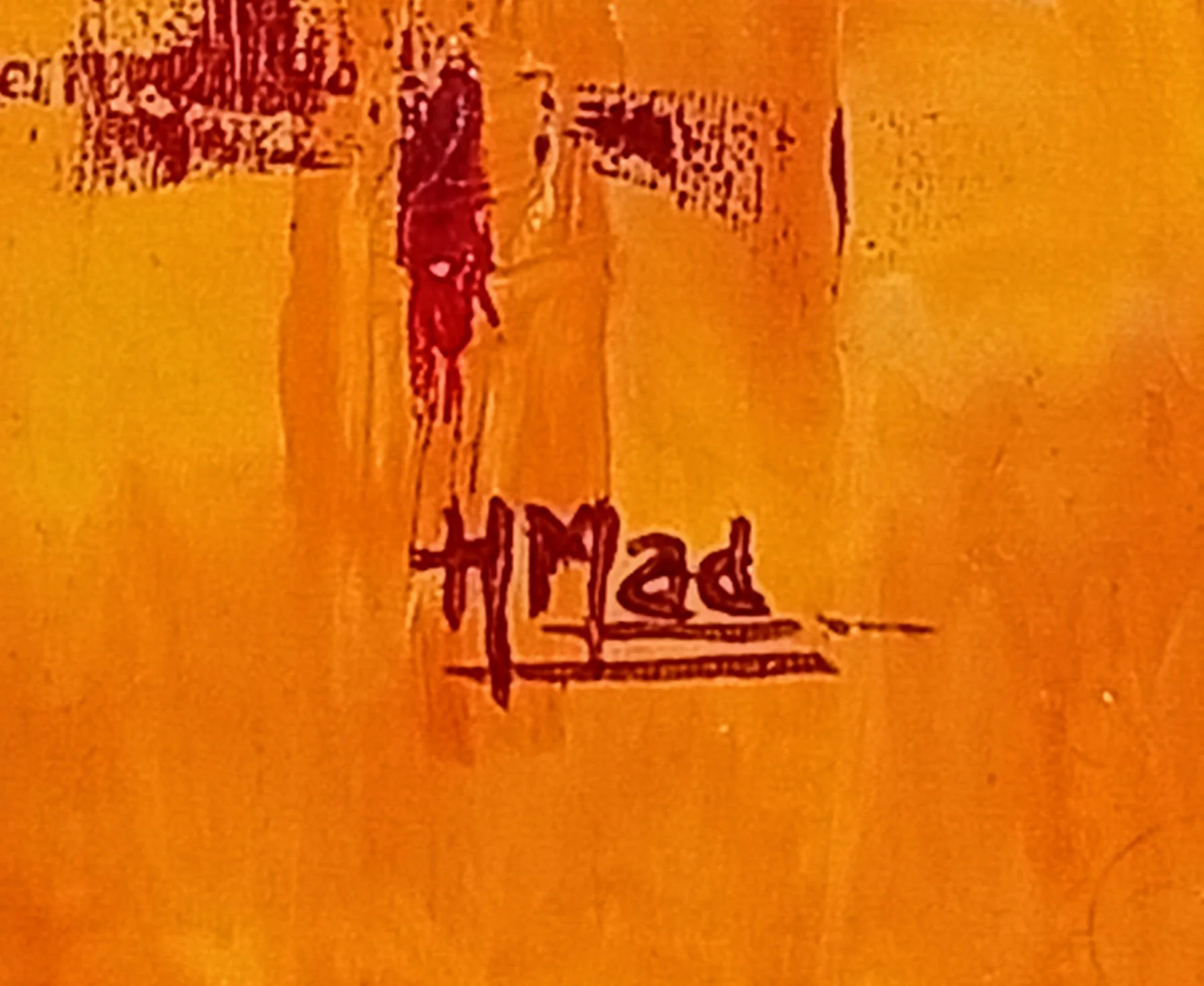 Assinatura “HMad” em tinta vermelha no canto inferior direito da pintura “Bloody Orange”, acrílico sobre tela, julho de 2020.