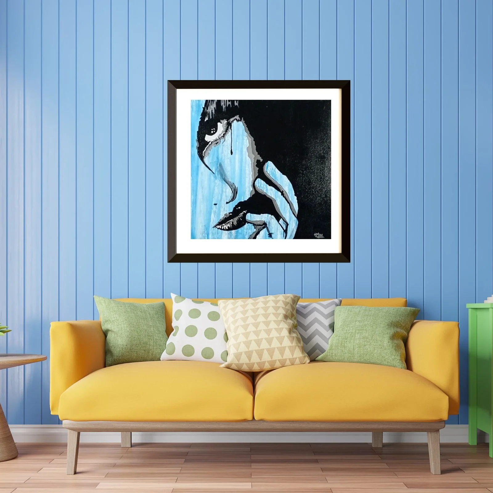 Mockup of the painting “100 000 Tears” by HMad, hanging on a blue wall above a yellow sofa with colorful cushions.