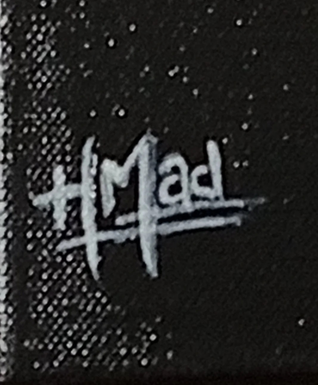 Detail of the “HMad” signature on the painting “The Exitment Of The Unexpected”, acrylic on canvas, July 2023.