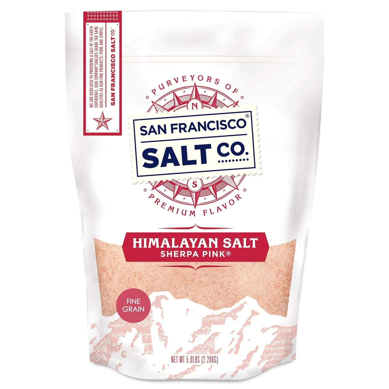 Front of a white bag of San Francisco Salt Co. Himalayan Pink Salt with red and navy blue text, and a mountain range illustration.