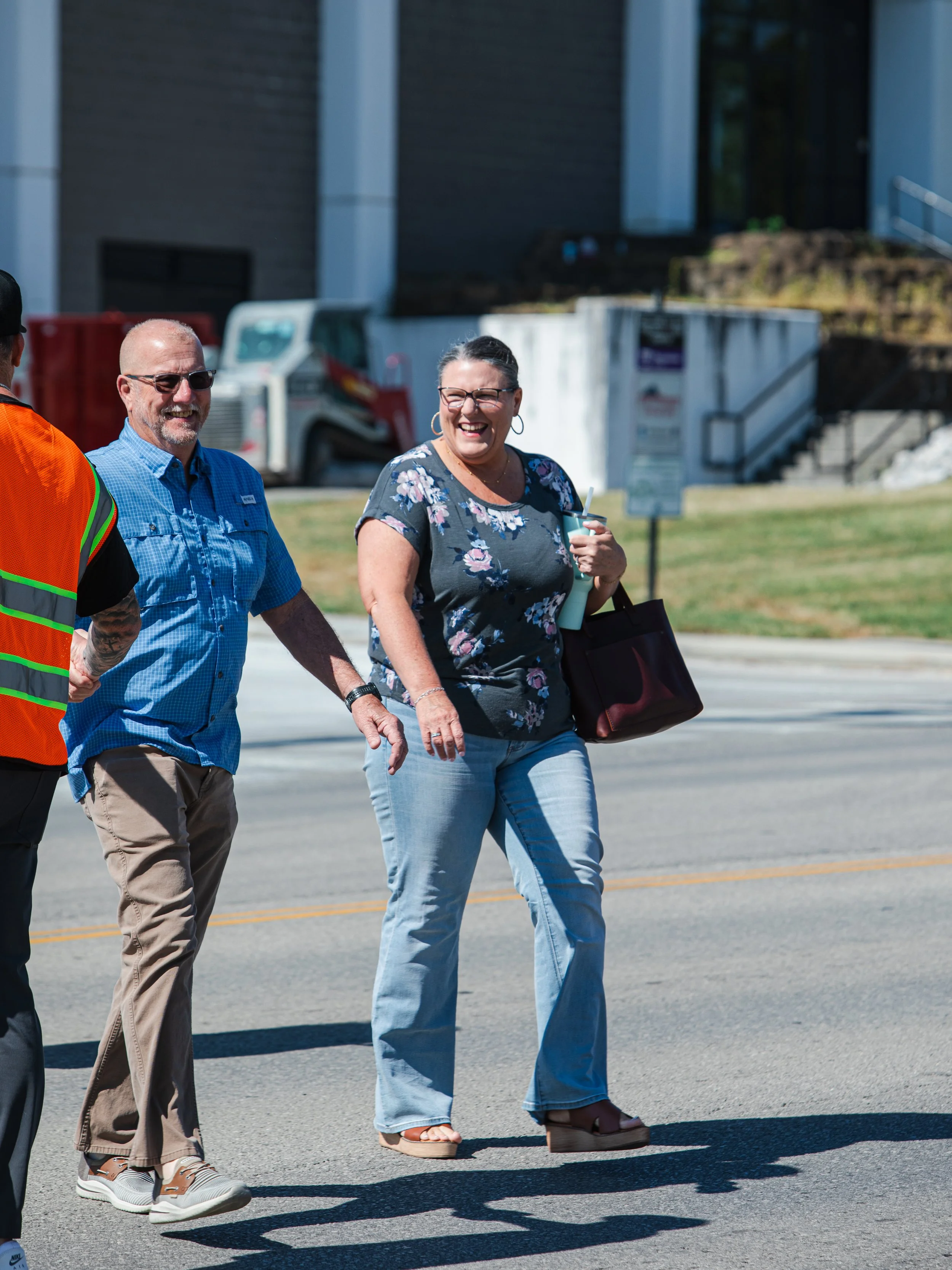 Two Good News Co. team members welcoming people outside in Cookeville.