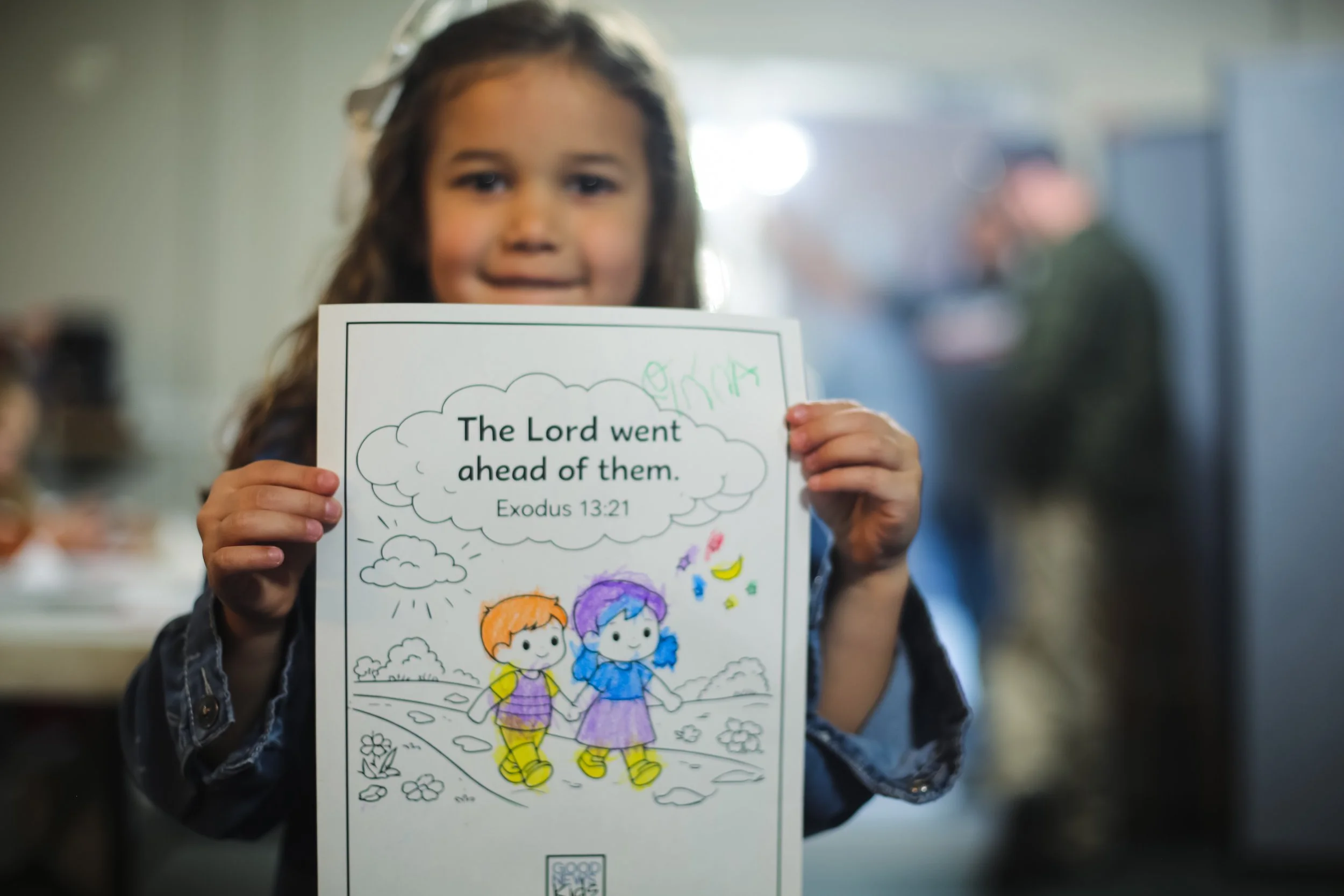 A child works through a Scripture activity at a table.