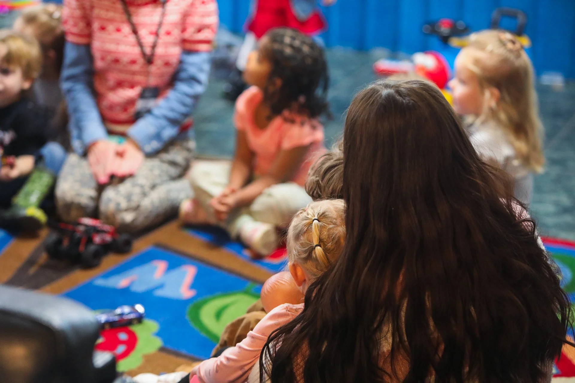 A Good News Co. leader engaging children in a ministry circle.