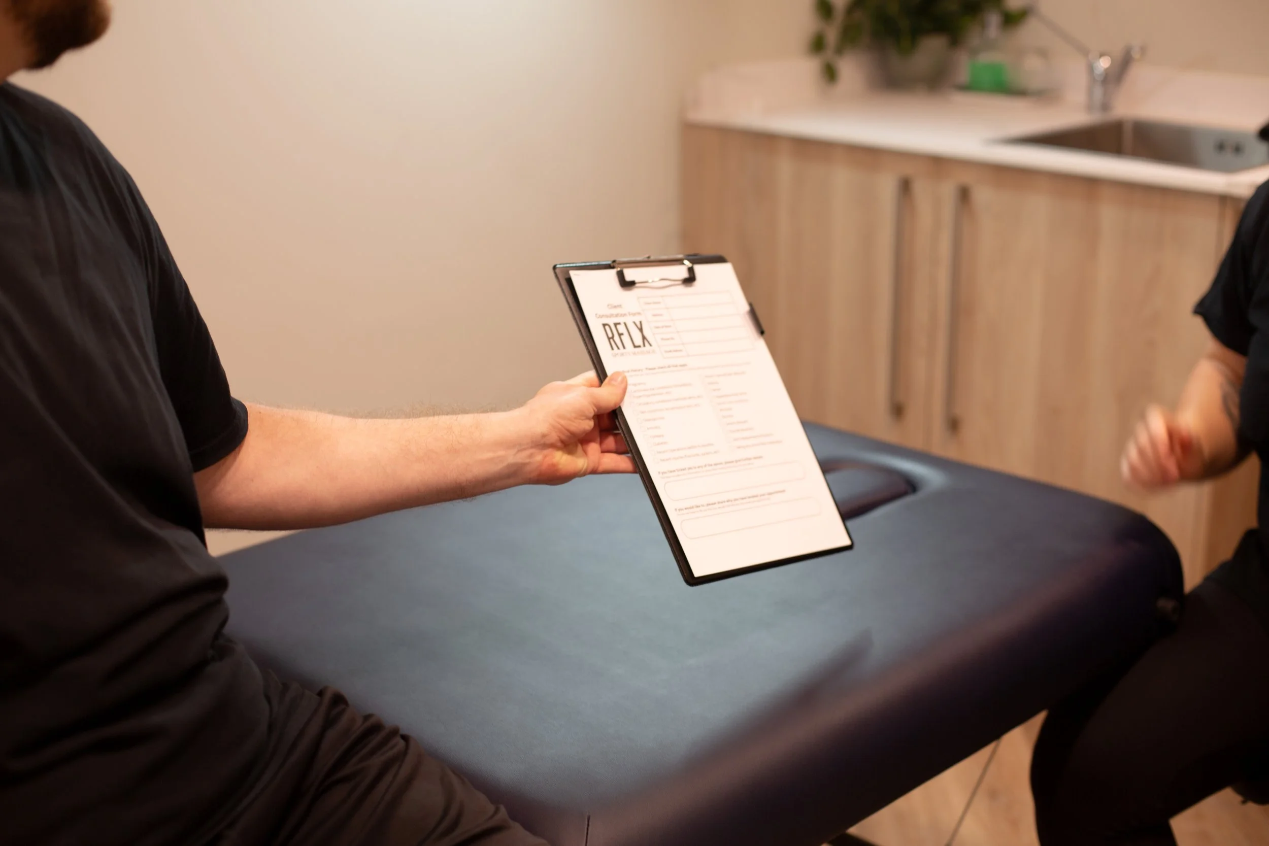 Consultation process at RFLX Sports Massage before treatment