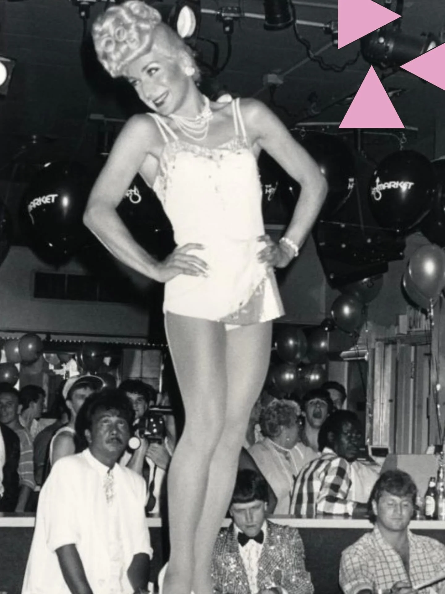 Joanna James posing on a stage in the crowded Haymarket Bar.
πΈ Susan Fleischmann
Coll 104 Gay Community News Photograph Collection. 
Were you there? Have a story to share? Drop a comment below or email us at info@historyproject.org!