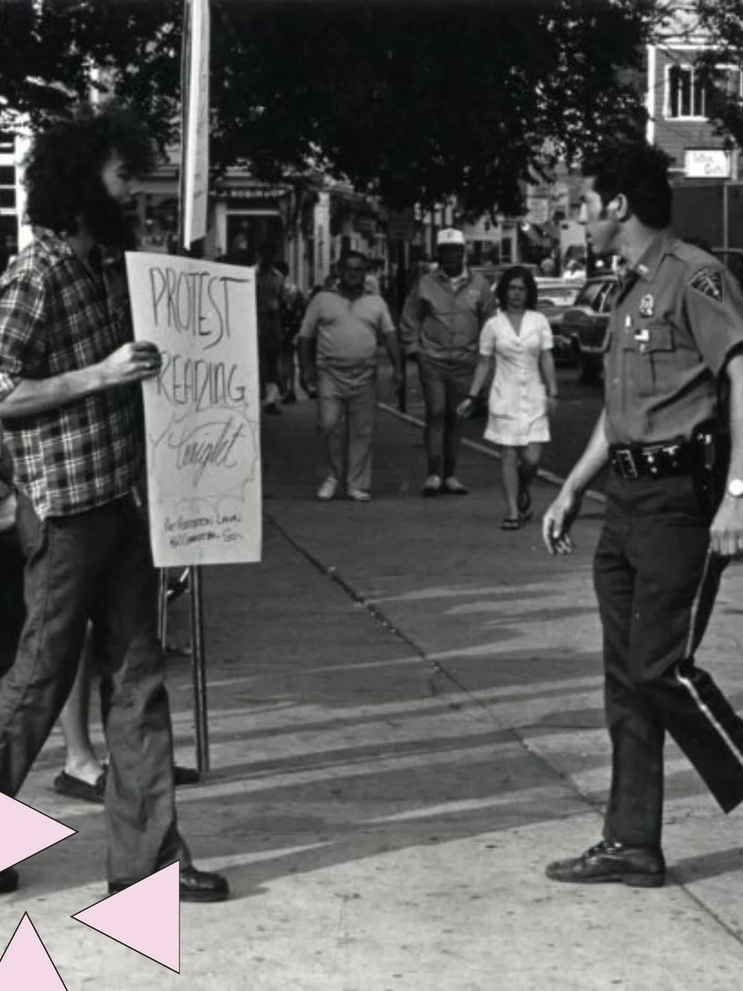 A man holding a sign reading: &ldquo;Protest Reading Tonight Art Association 460 Commercial St.&rdquo; (Provincetown, MA) is met by police officers on the street. The protest was on behalf of Good Gay Poets.

This photograph is part of our Gay Commun