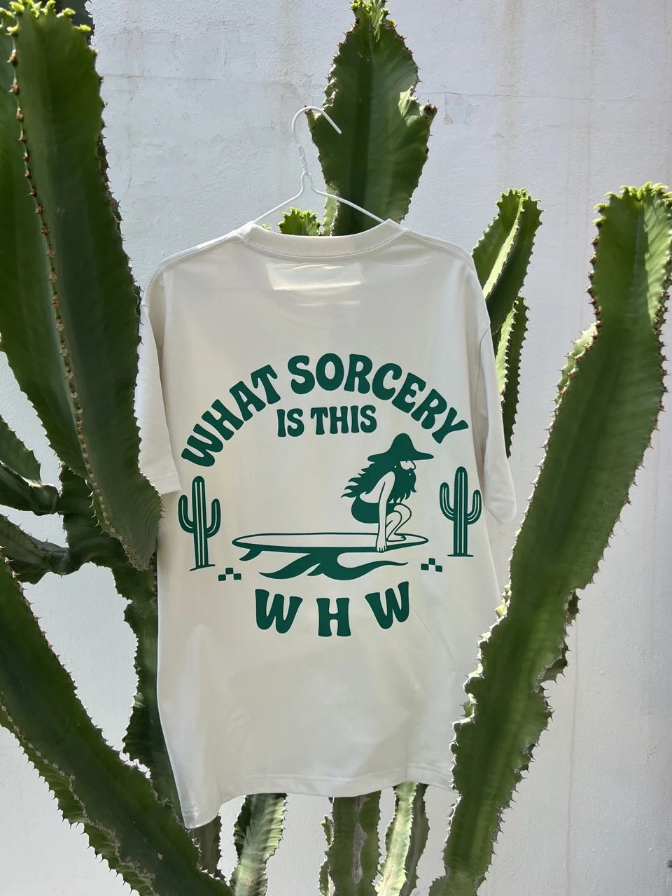 Embrace your inner beach bum wizard with the Wavy Haired Weirdos Surf Tee, the ultimate symbol of seaside freedom and tranquility.