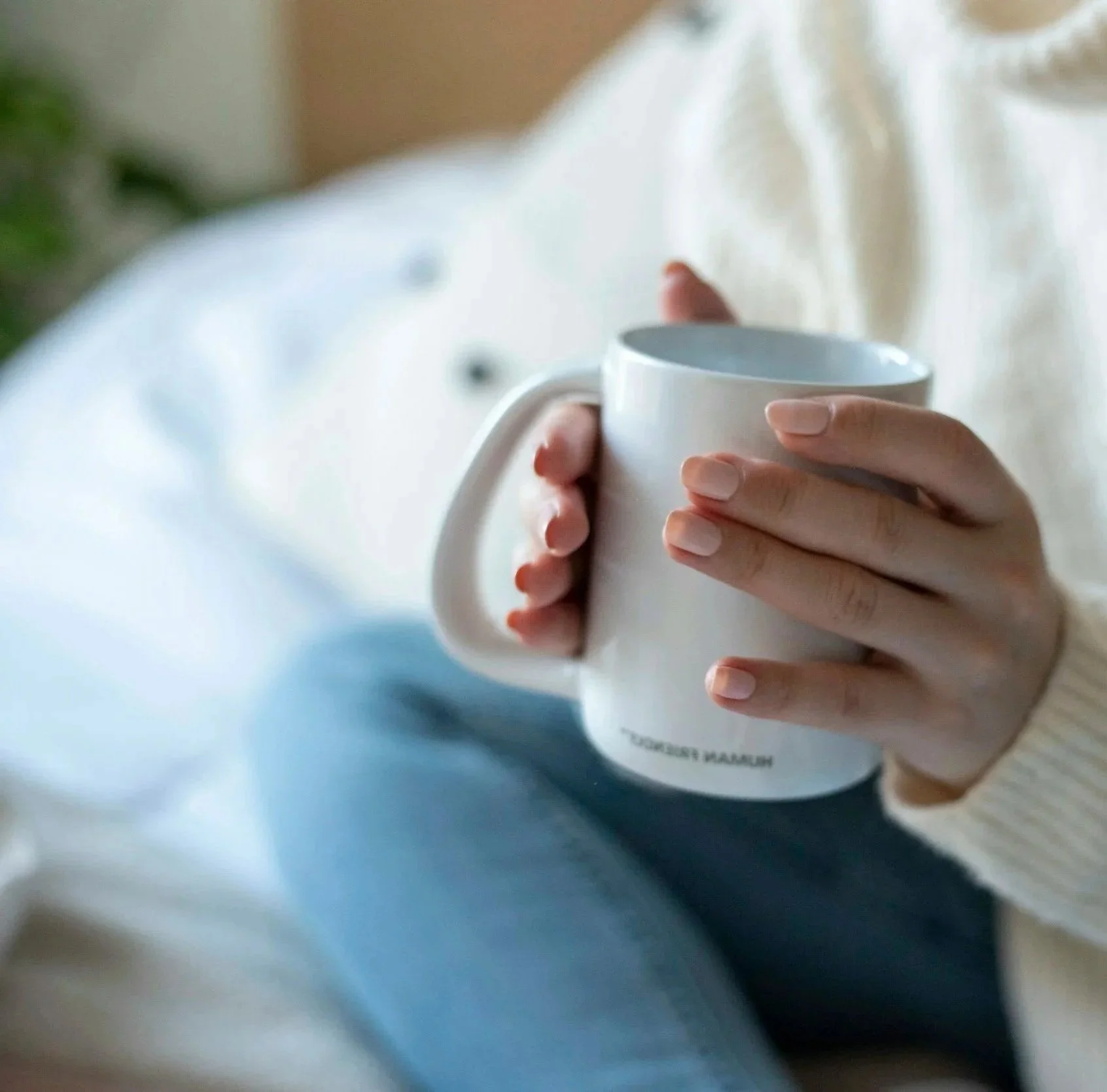 Women Holding a coffee cup second guessing every decision